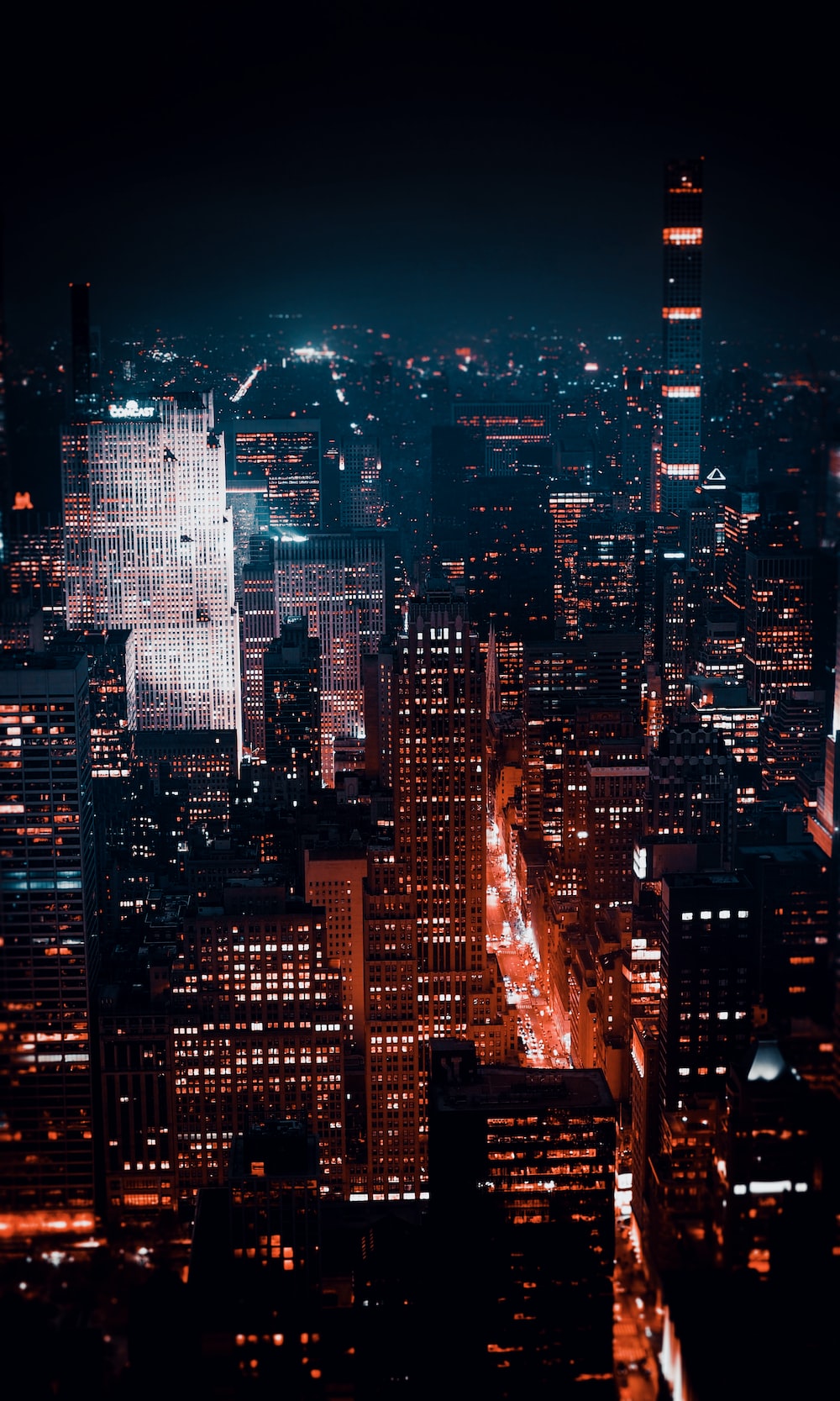 Aerial Photography Of City With High Rise Buildings During Night Time Photo