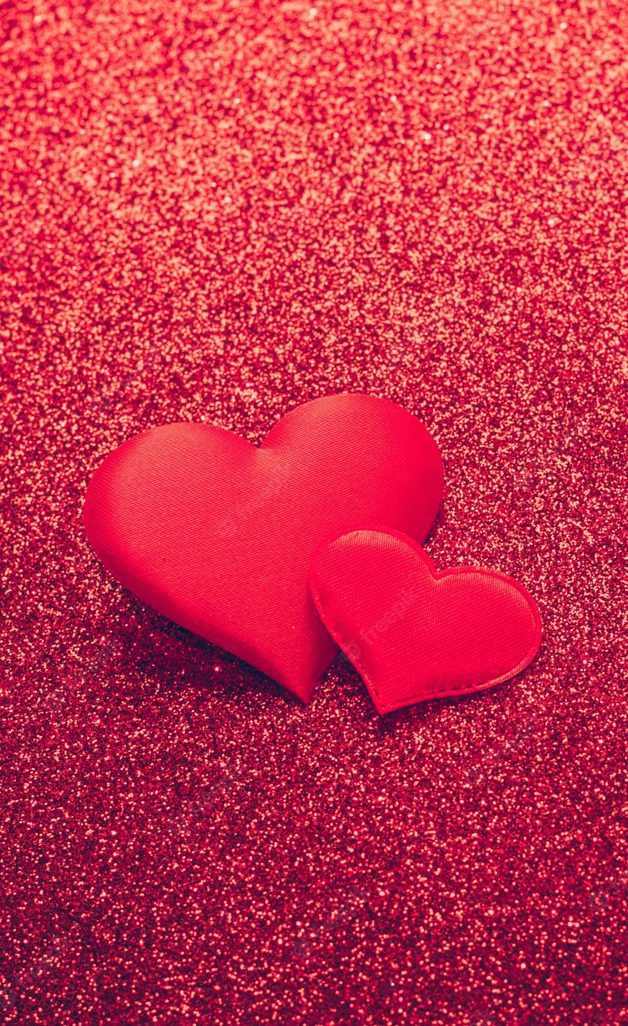 Premium Photo. Two red heart symbol of love on a shiny background valentines day concept vertical frame copy space