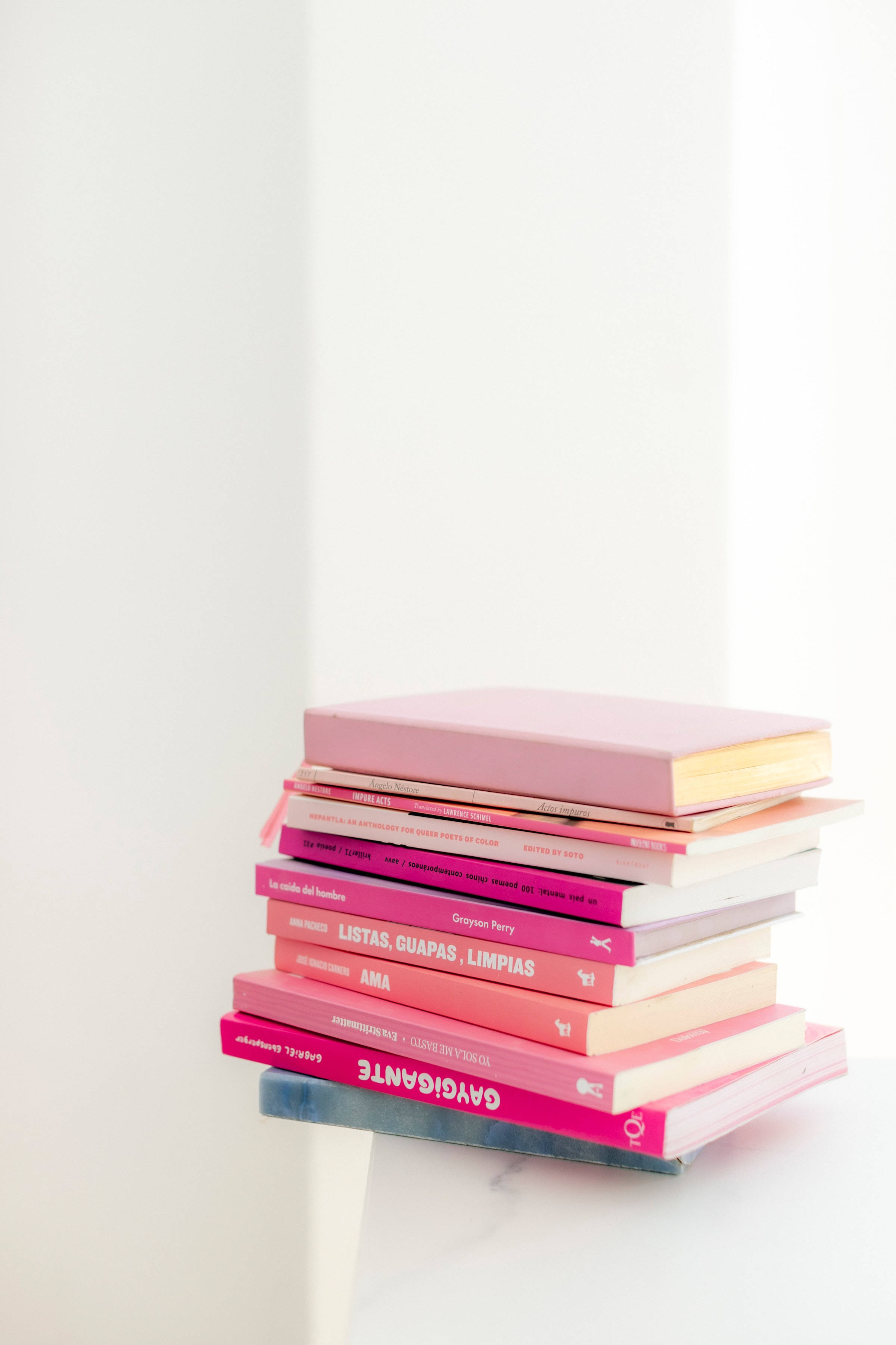Download Cute Pink Aesthetic Pile Of Books Wallpaper