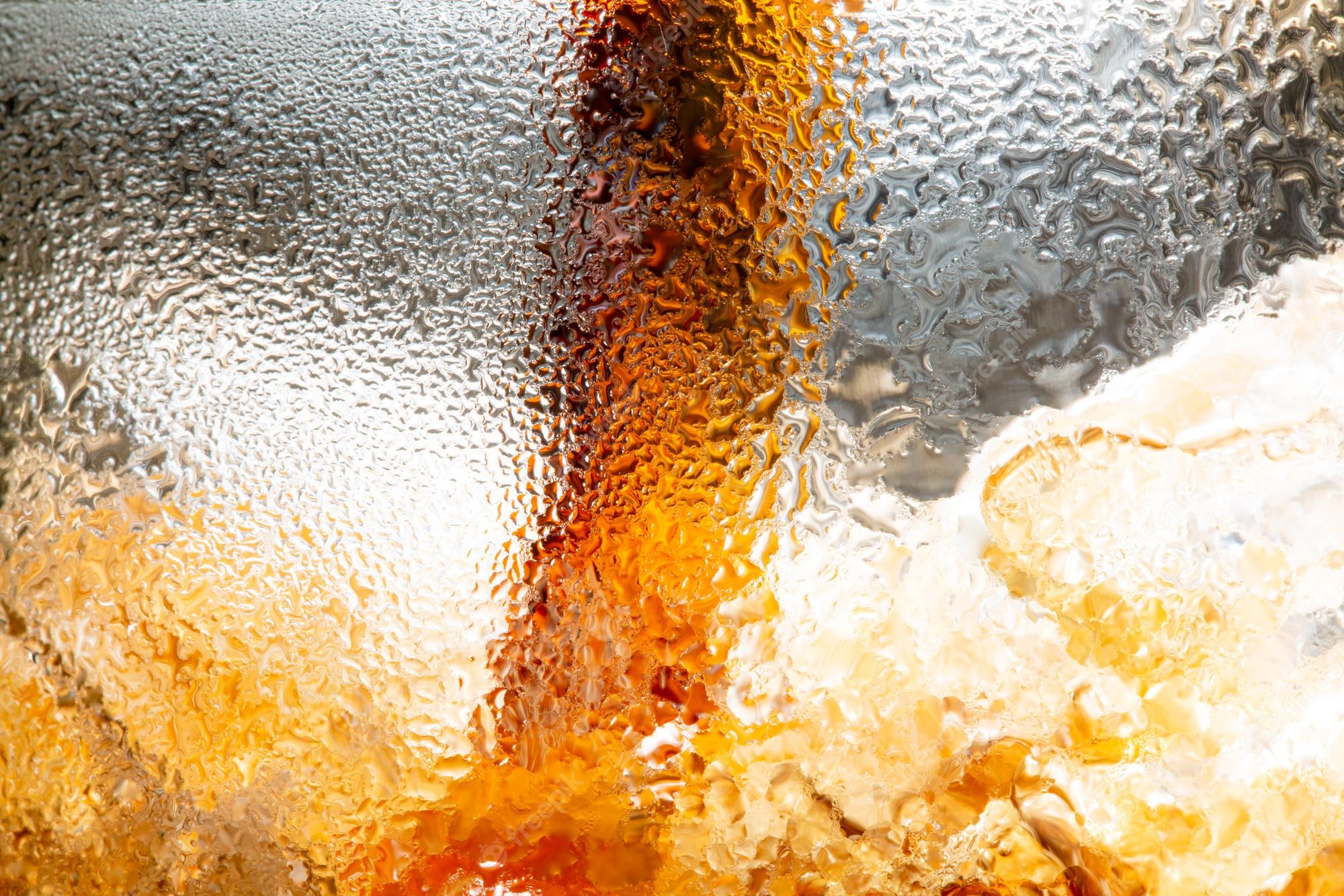 Premium Photo. Soft drink pouring into a glasspouring cola soda with ice and bubble on front view white background