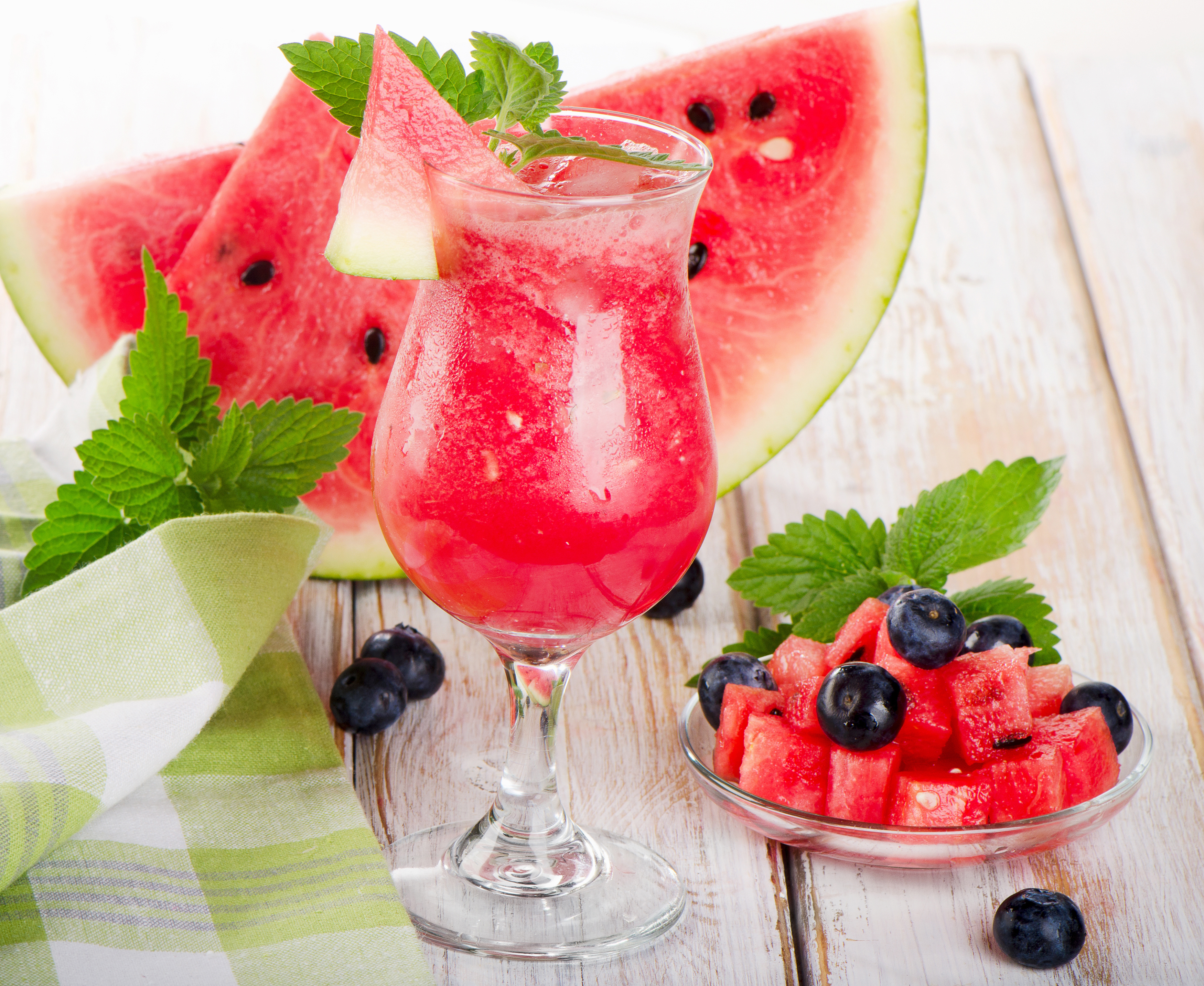 Watermelon juice with ice in a glass with fresh watermelon and blueberries Desktop wallpaper 1024x1024