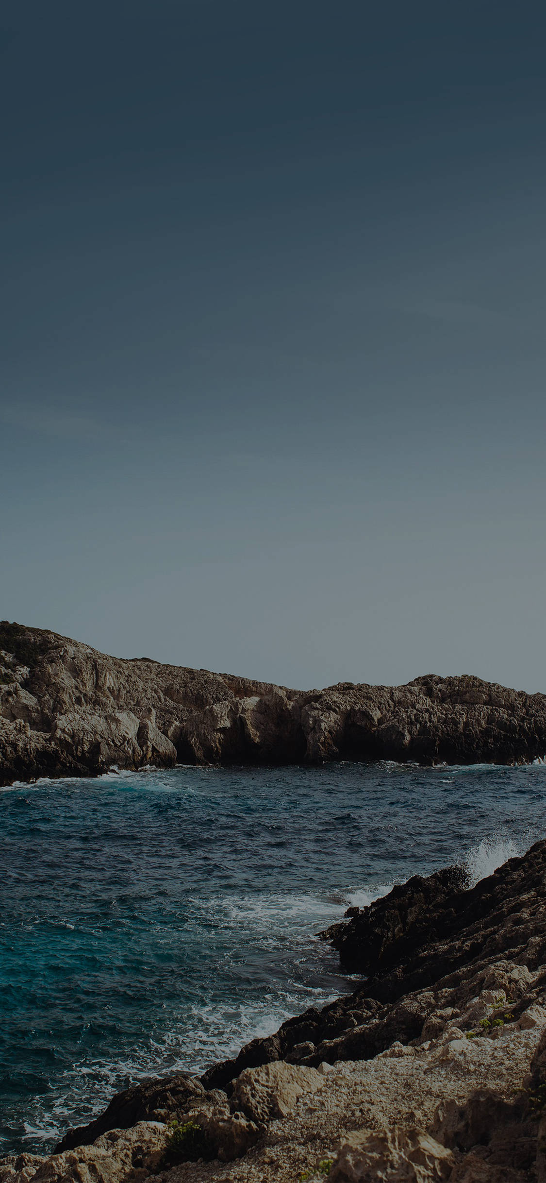 Download iPhone X Beach And Rock Cliffs Wallpaper