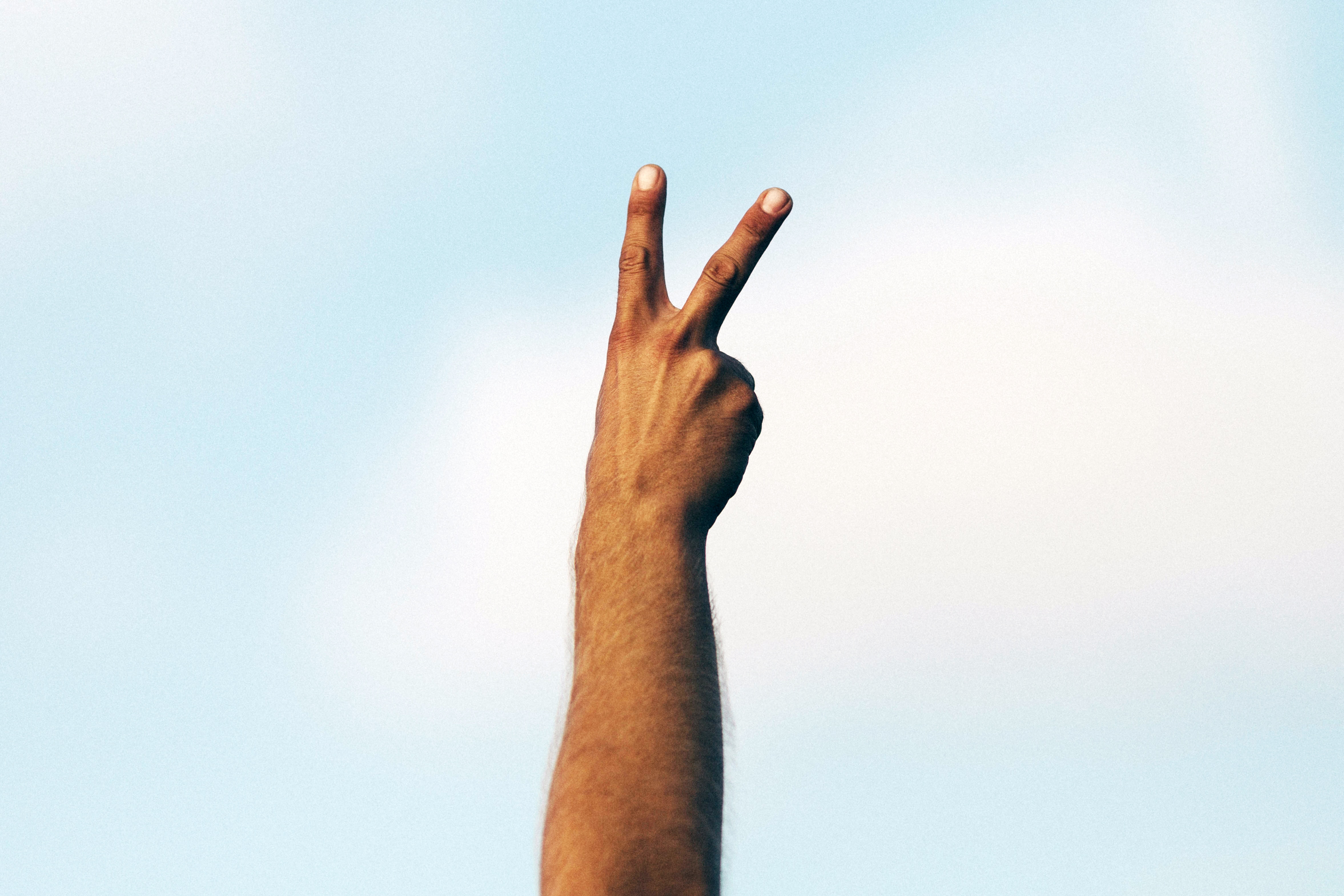 4707x3138 victory, blue, sky, person, finger, PNG image, hand, hand up, blue sky, arm, peace sign, peace Gallery HD Wallpaper