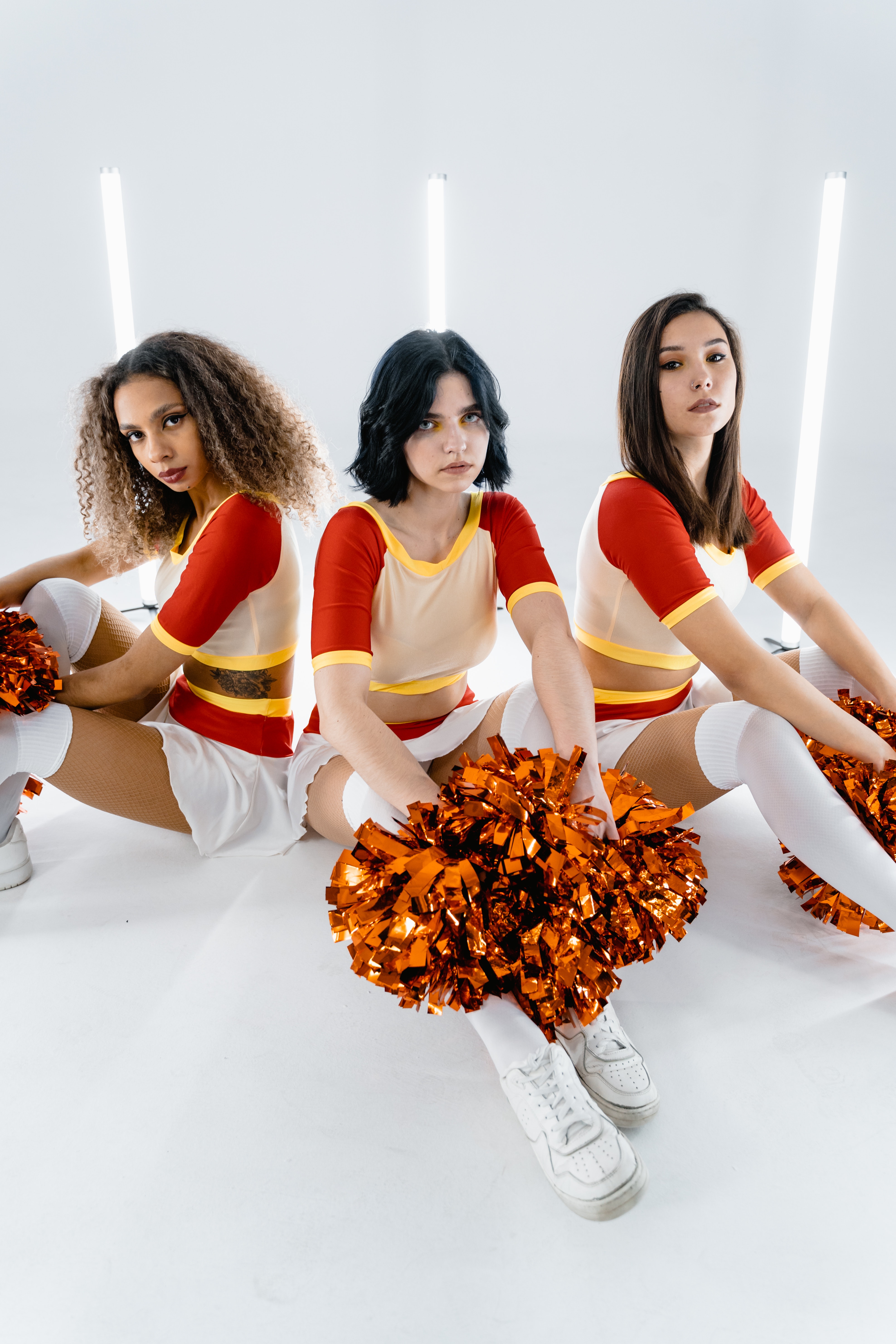 A Cheerleader With Red Pom Poms · Free