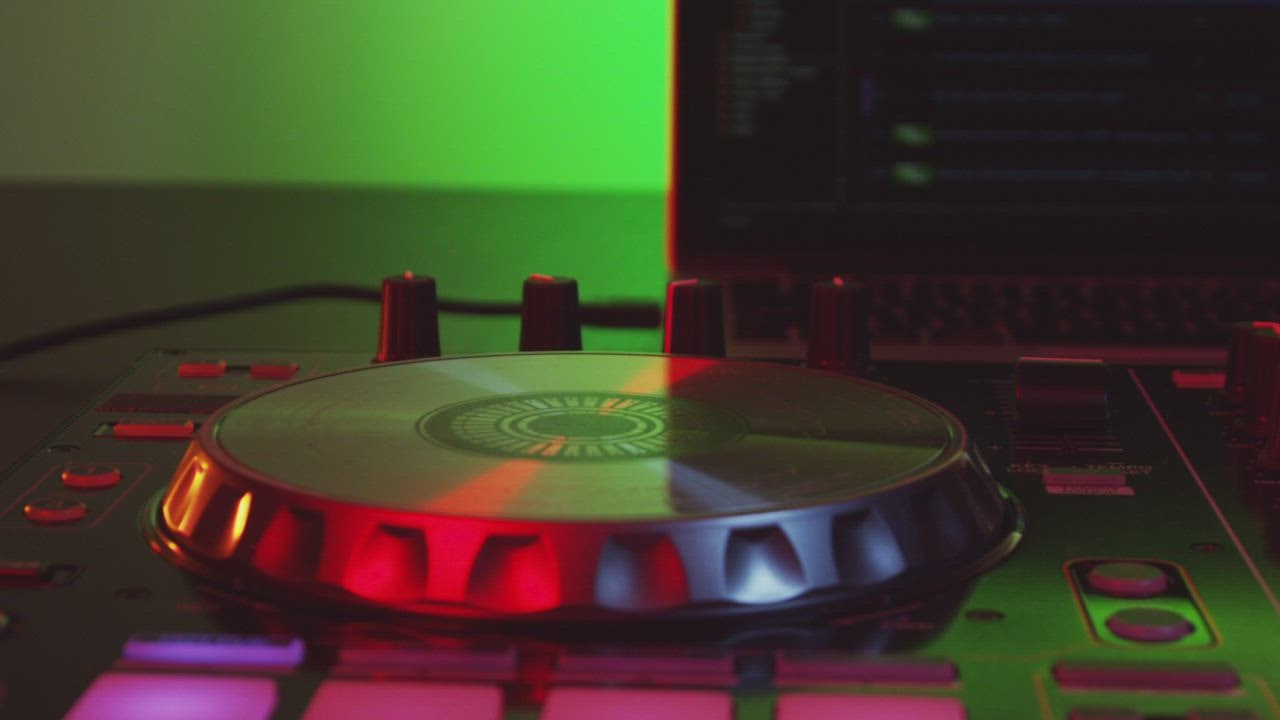 Disco lights reflecting against a DJ table Stock Video