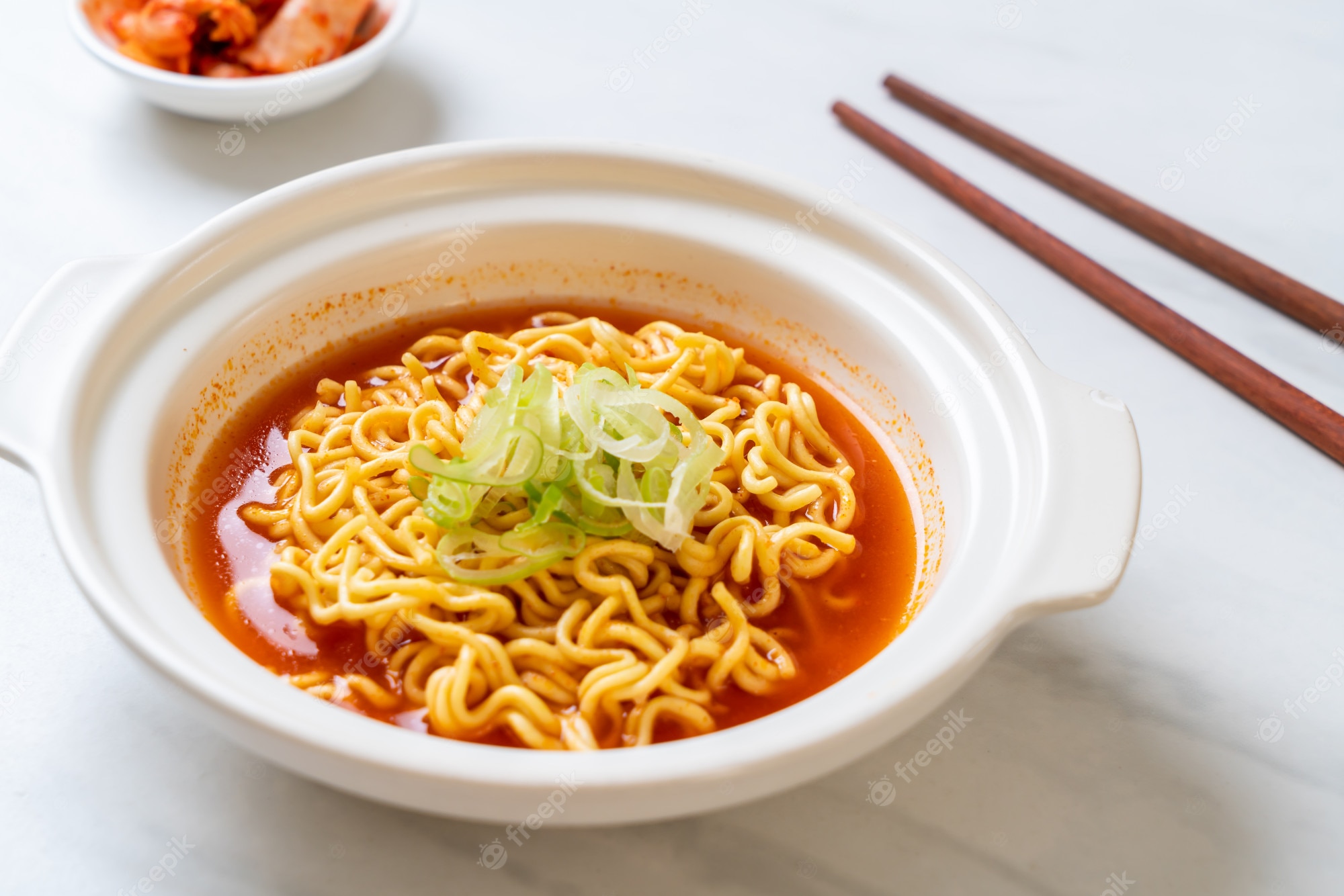 Premium Photo. Korean spicy instant noodles with kimchi