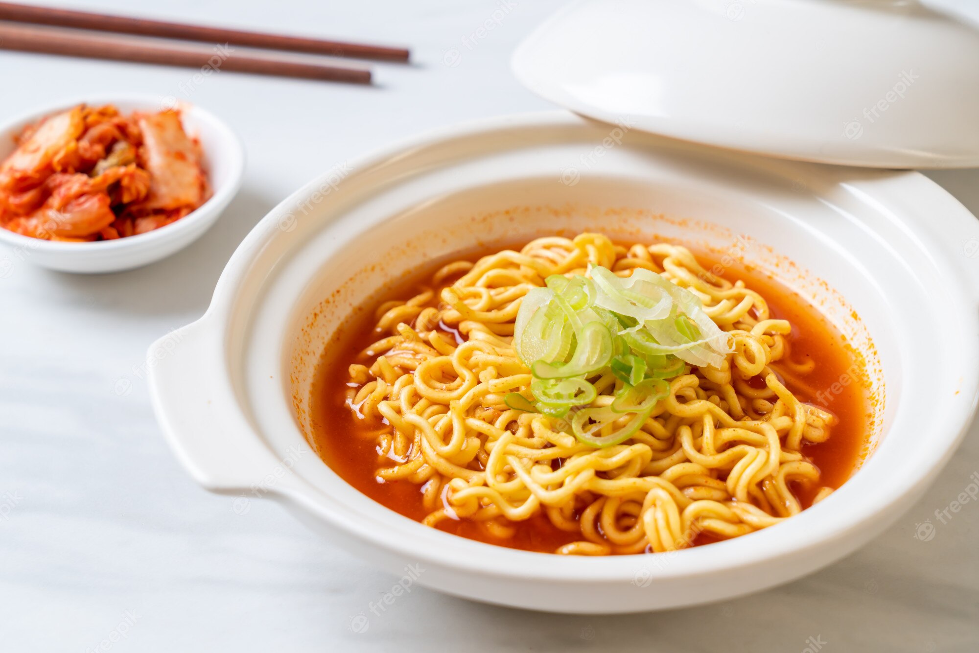 Premium Photo. Korean spicy instant noodles with kimchi