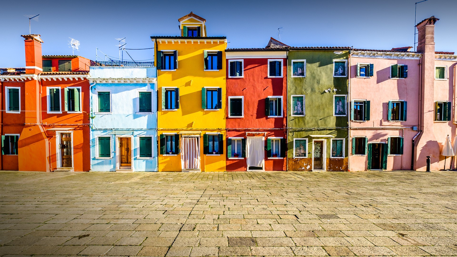 Famous old town of the village Burano near Venice, Italy. Windows 10 Spotlight Image