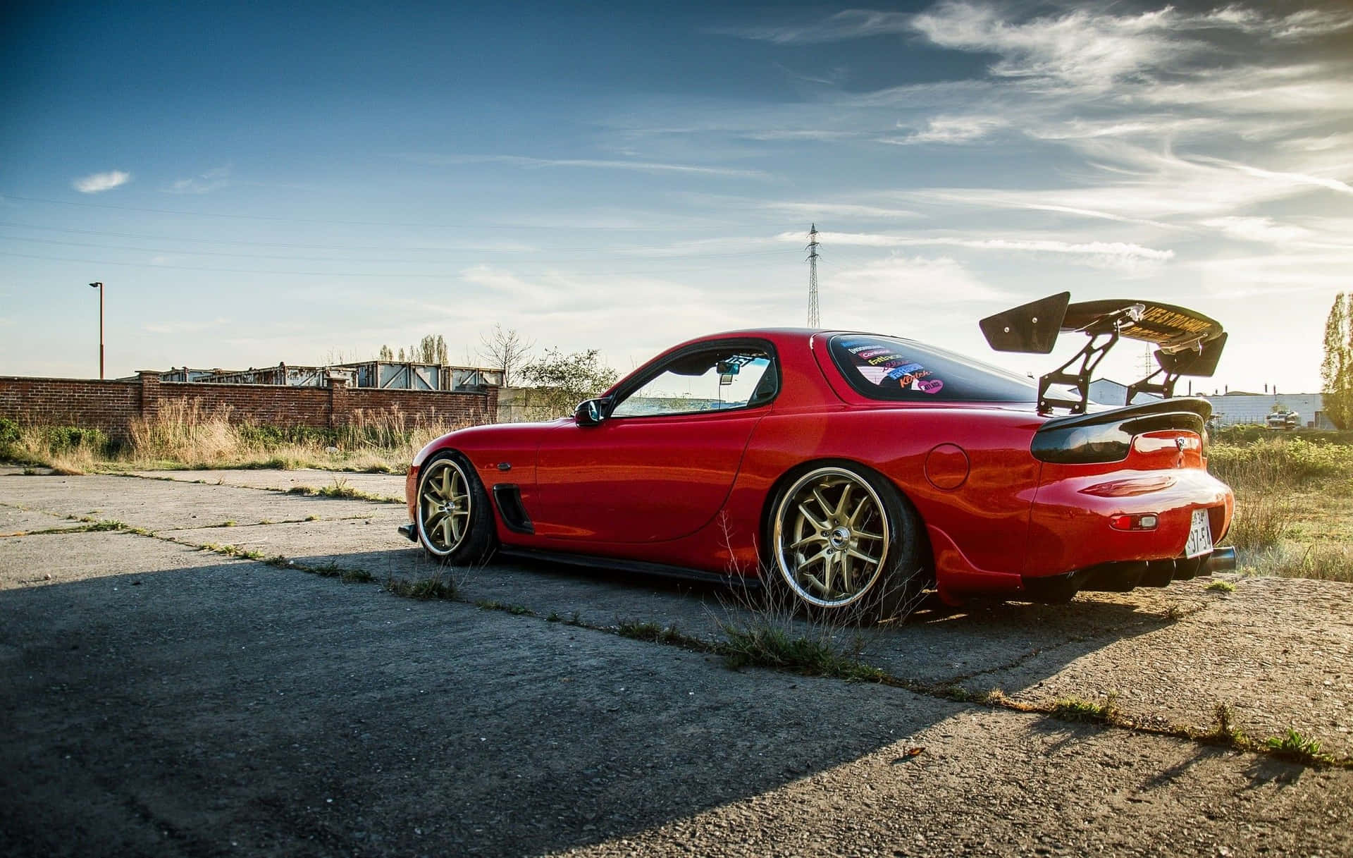 Download Red Mazda Rx 7 Under Blue Sky Wallpaper