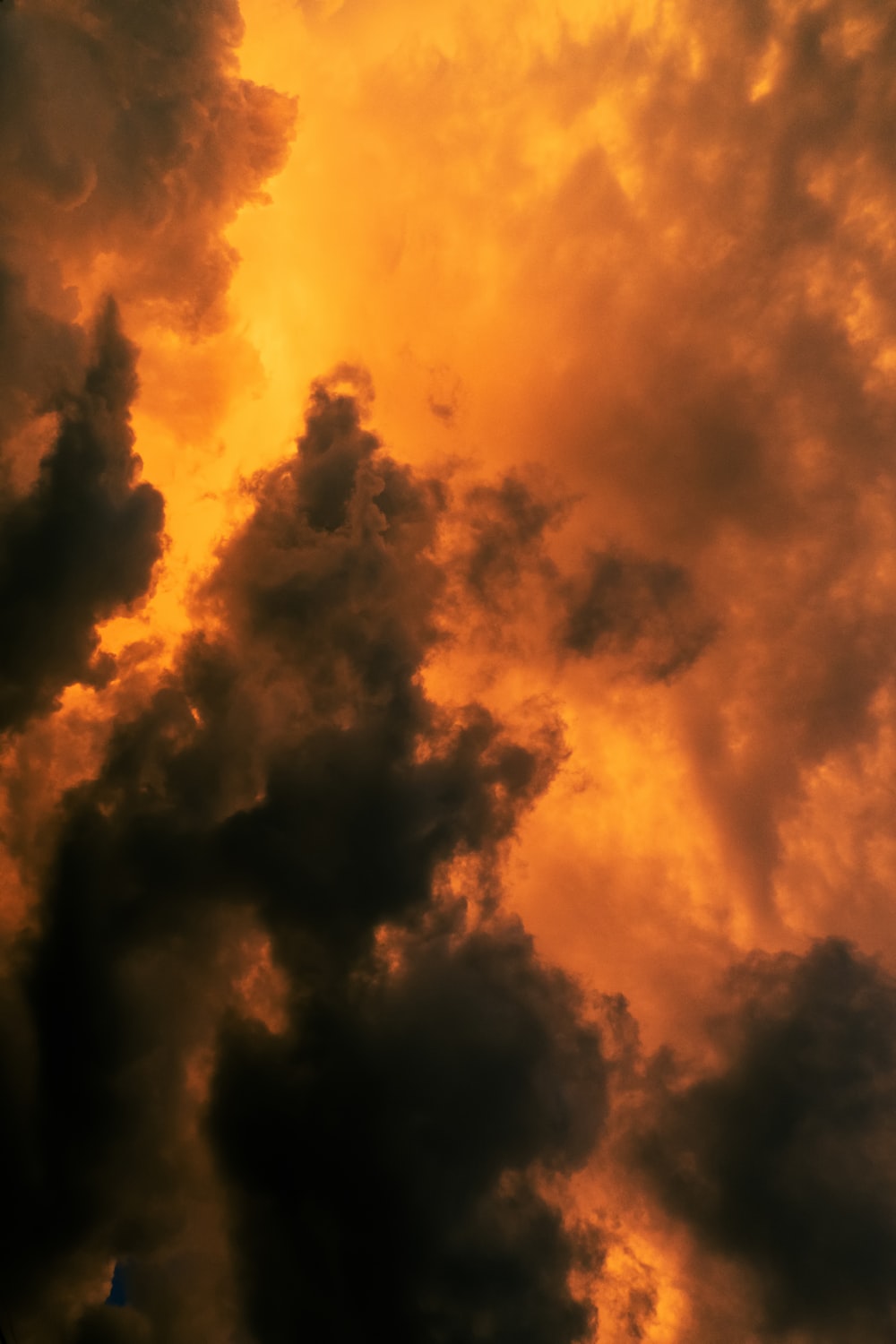 orange and black clouds during sunset photo
