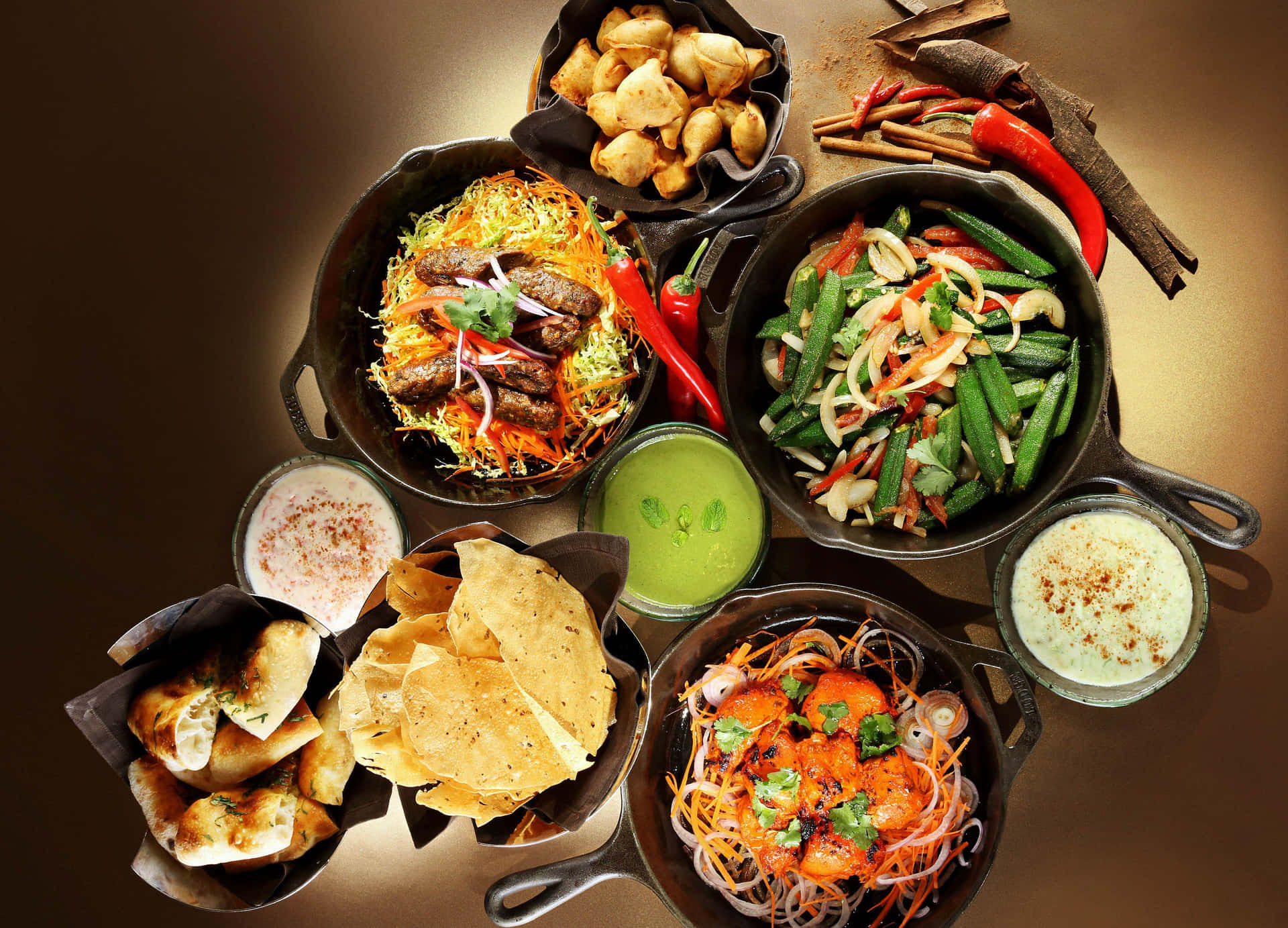 Download Indian Food In Black Pans Wallpaper
