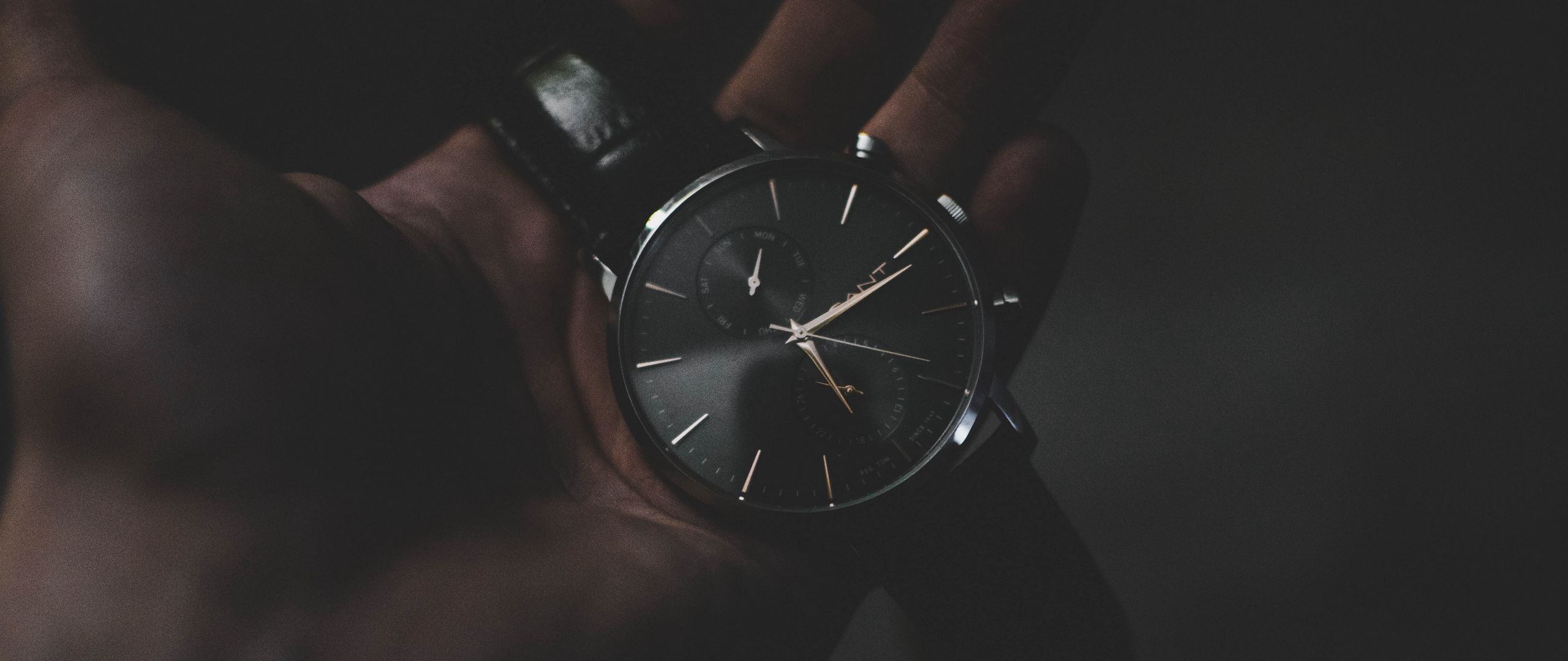 Download wallpaper 2560x1080 wrist watch, dial, hand, dark dual wide 1080p HD background