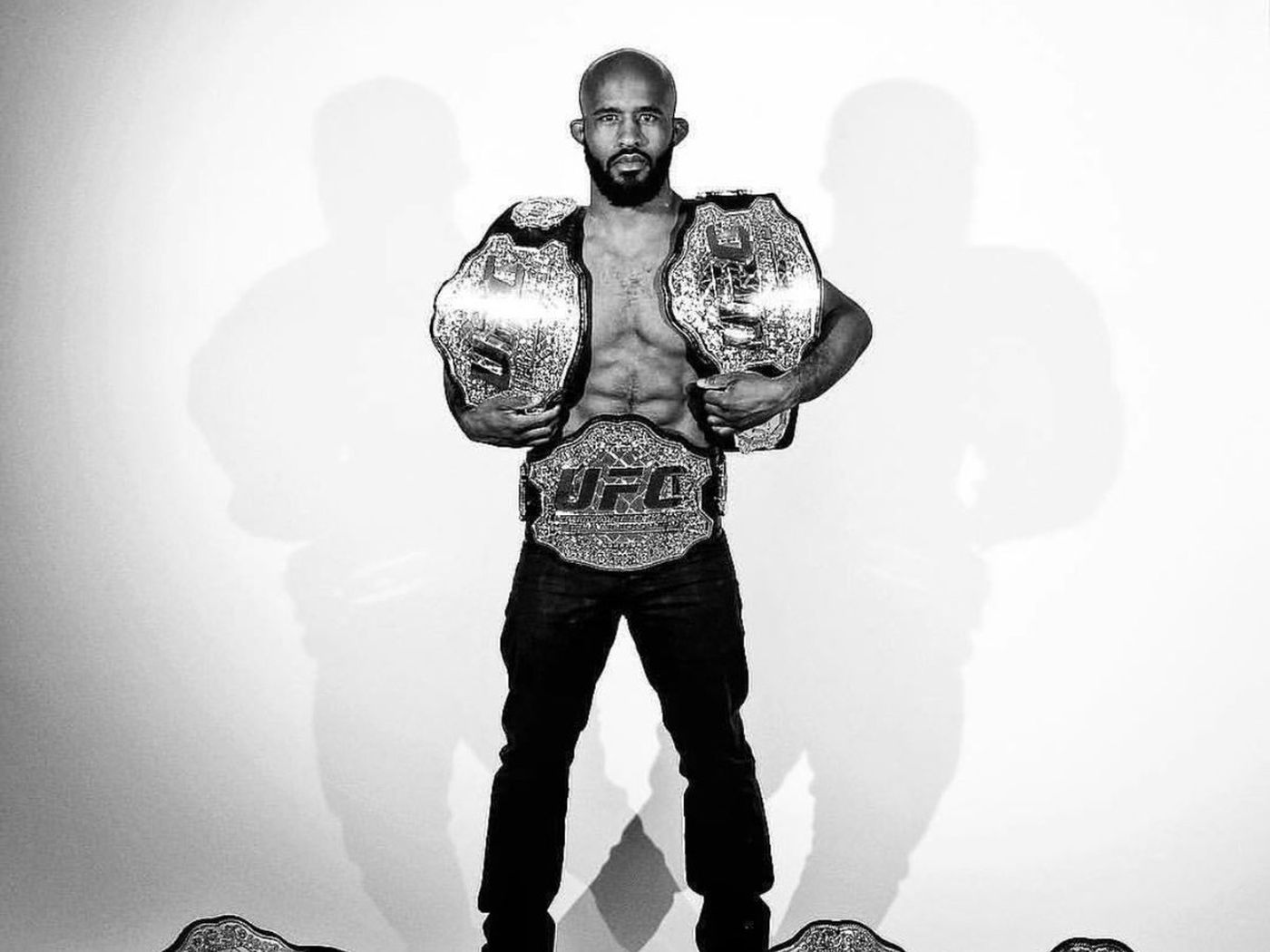 Pic: UFC (finally) sends Demetrious Johnson ALL THE BELTS!