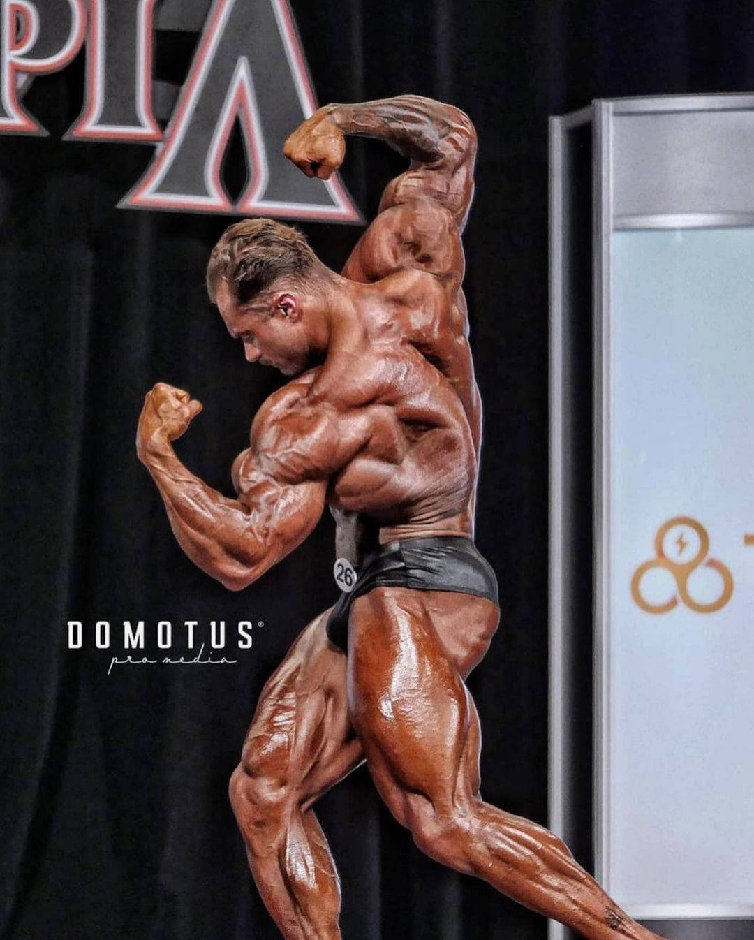 Download Chris Bumstead At Mr. Olympia Competition Wallpaper