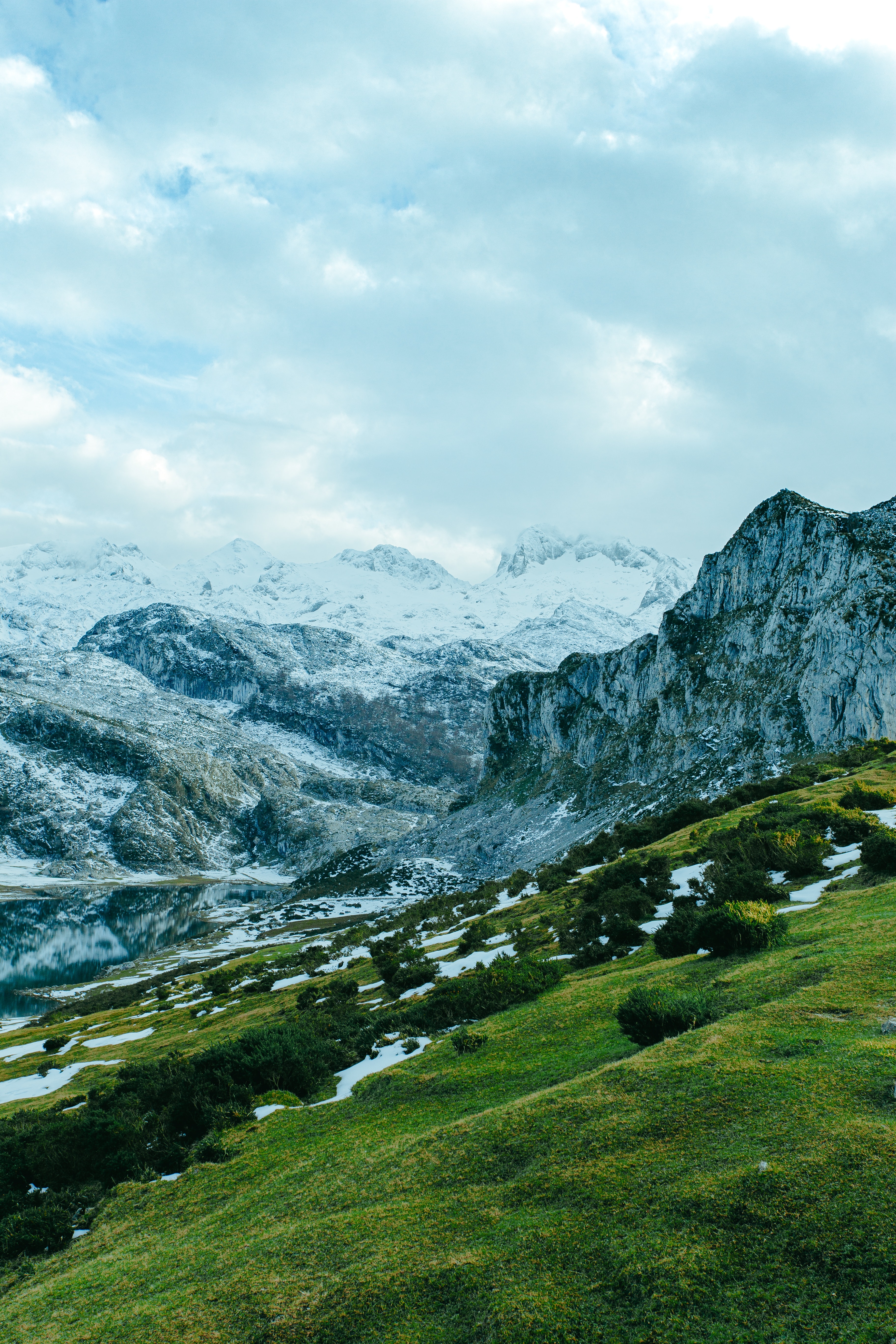 Green Grass Field Near Snow Covered Mountain · Free