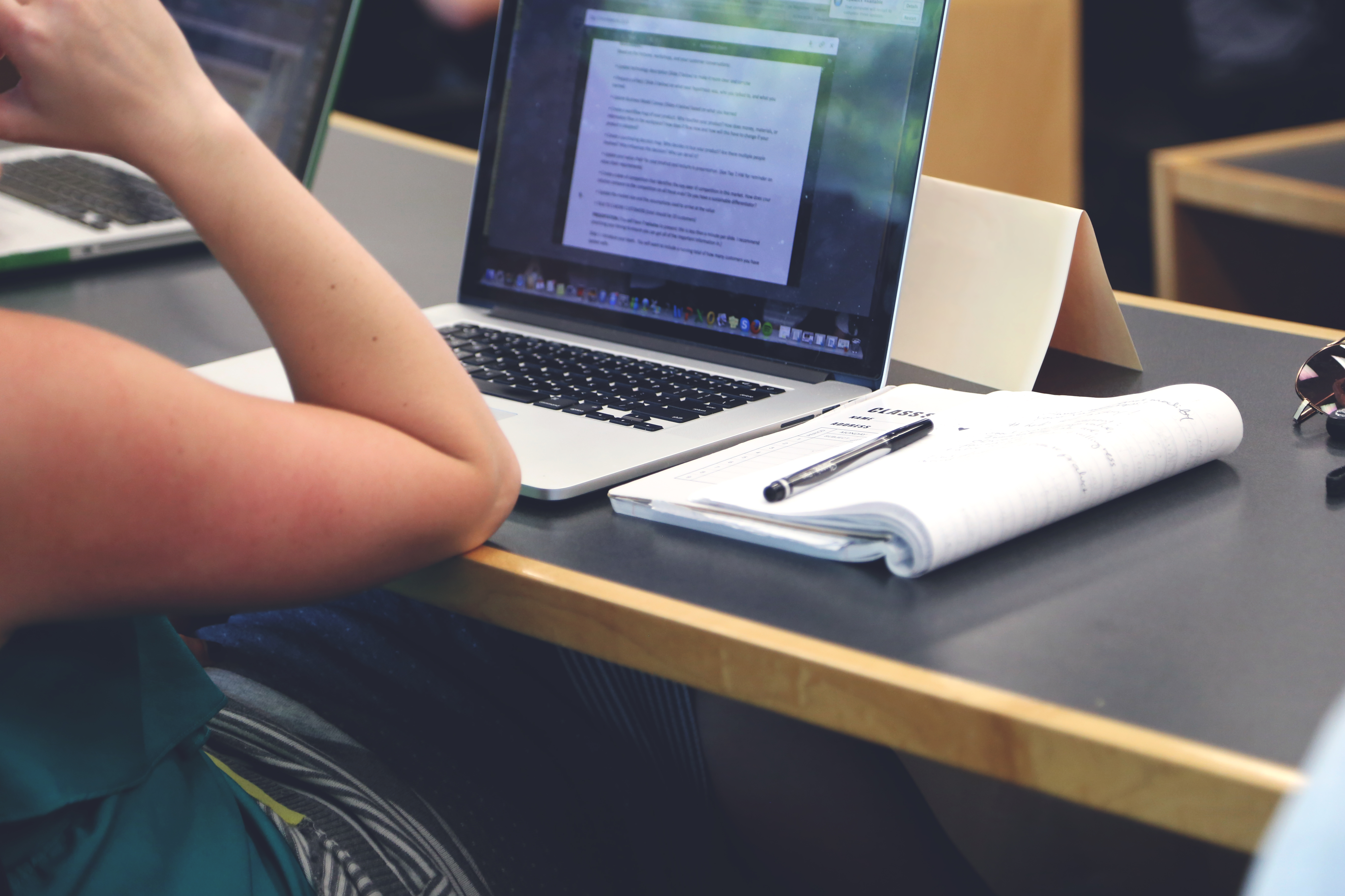 Person Sitting in Front of the Laptop Computer · Free