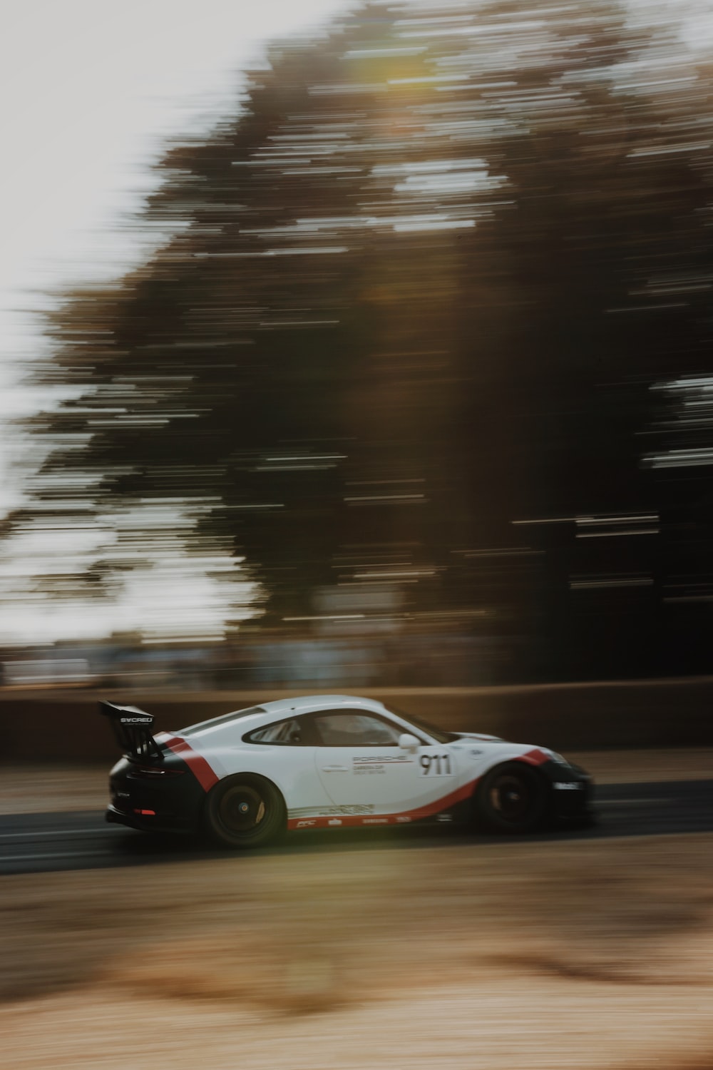 panning photography of racing car photo