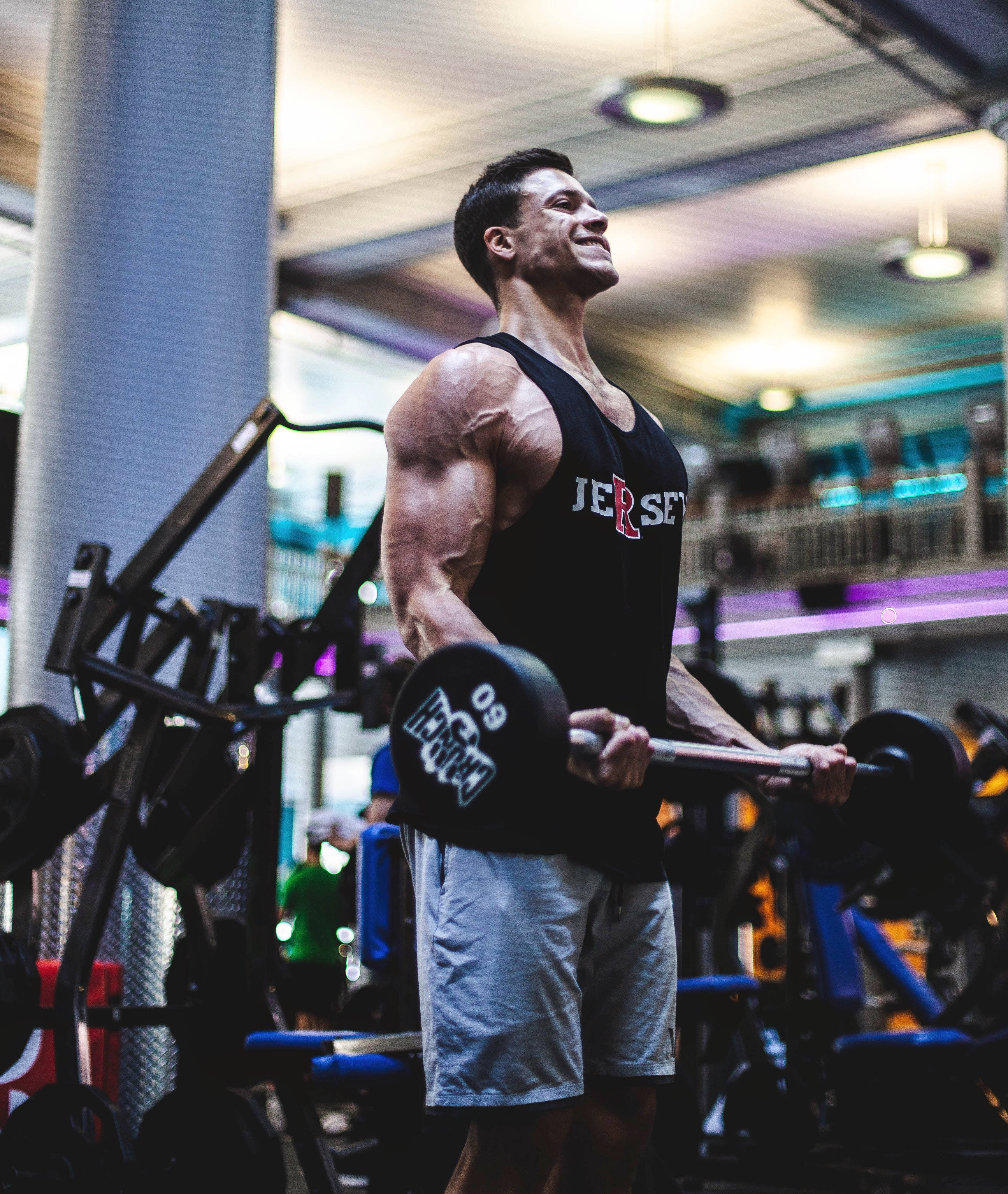 Download Muscular Man In Gym Wallpaper
