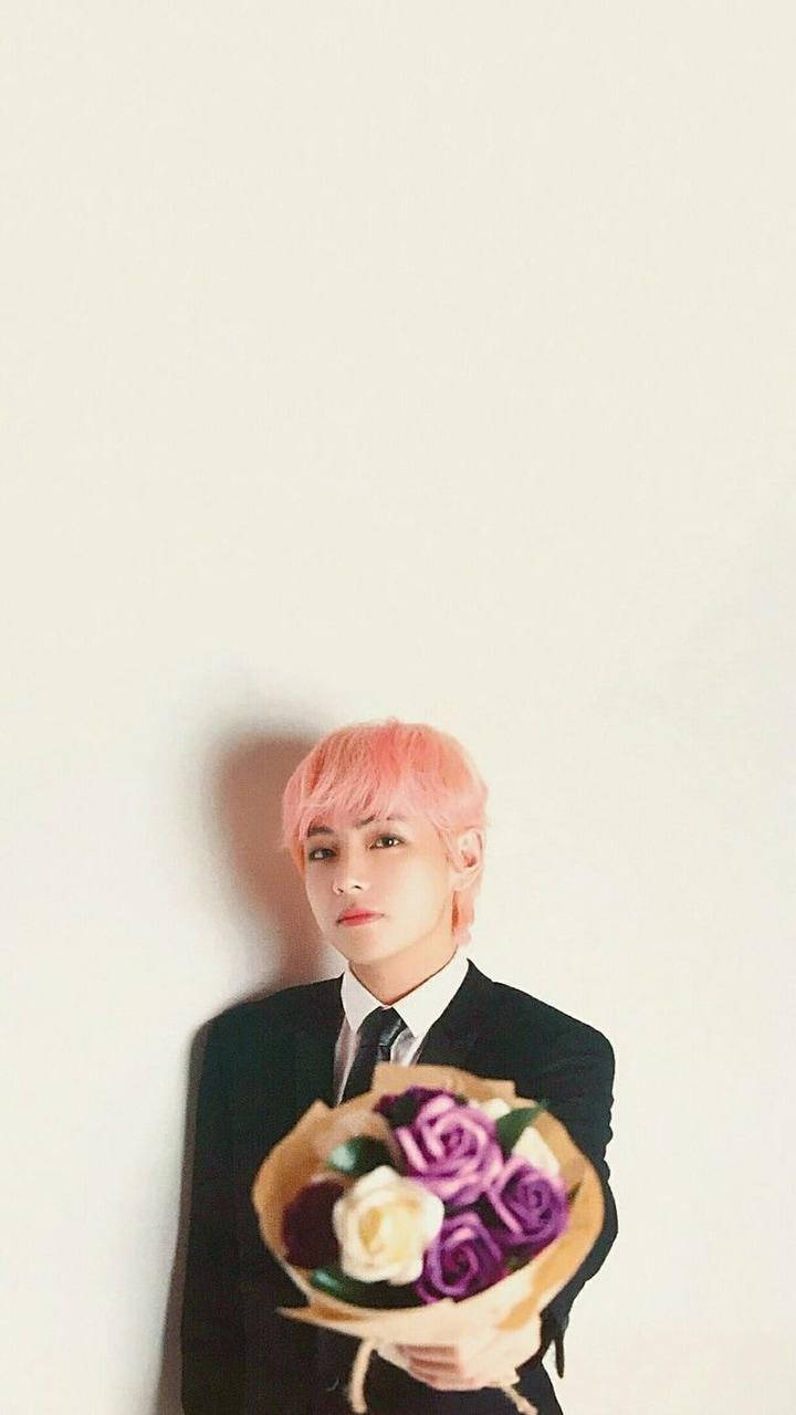 Download Taehyung Cute With Flower Bouquet Wallpaper
