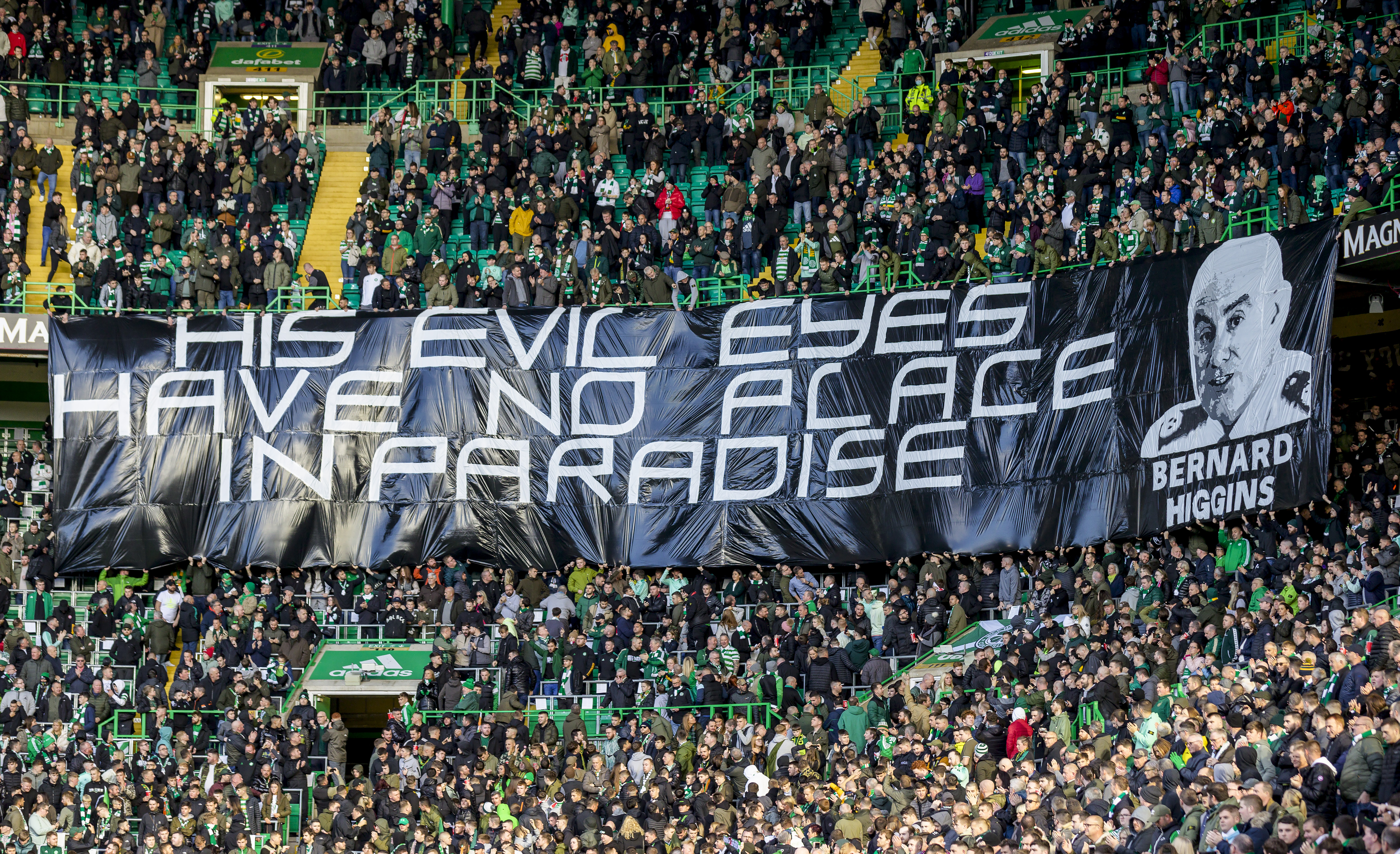 Celtic fans unfurl banners and stage silent protest as cop chief Bernard Higgins linked to Hoops security role. The Scottish Sun