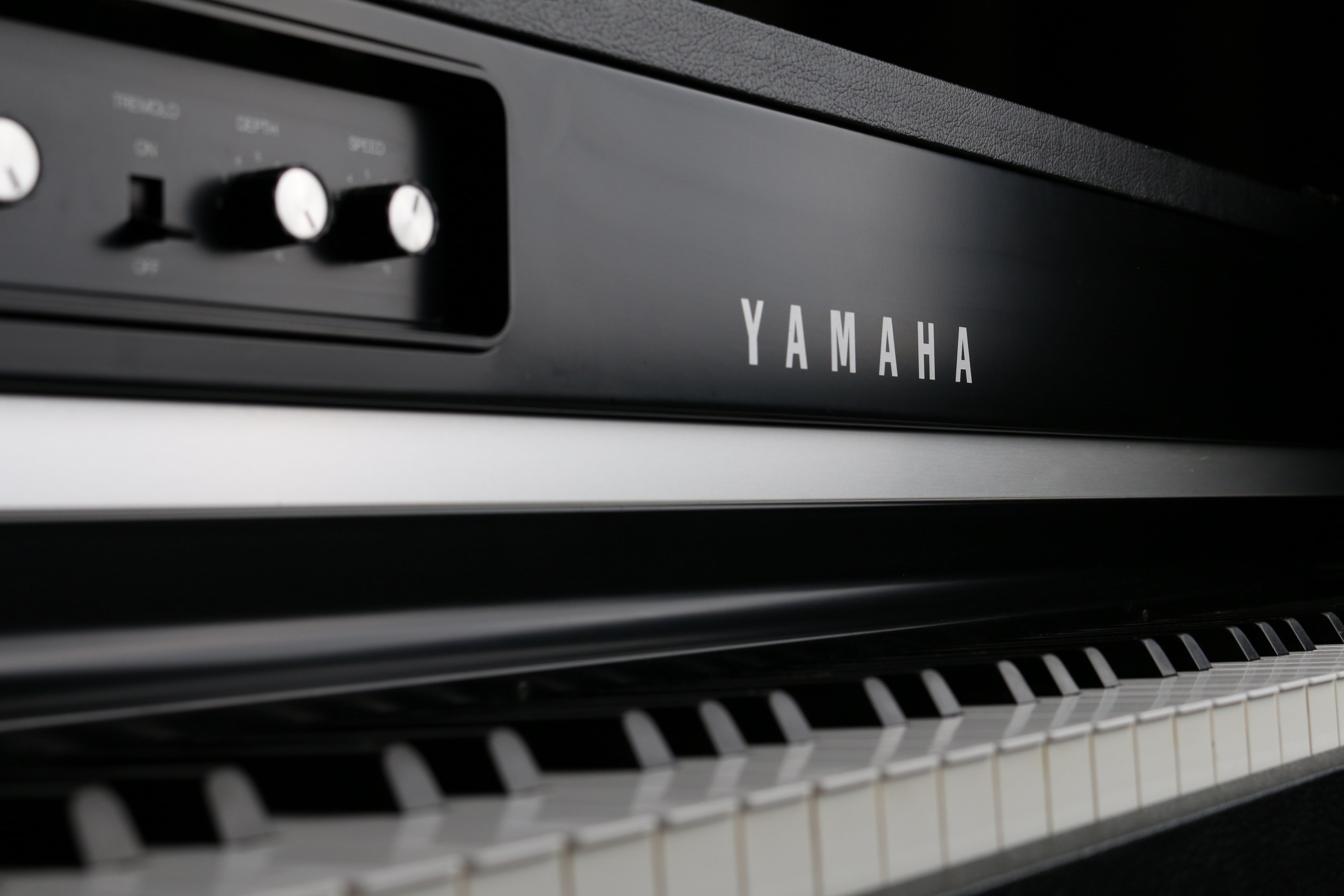 Wallpaper / a close up of a black and white yamaha keyboard, yamaha piano 4k wallpaper free download