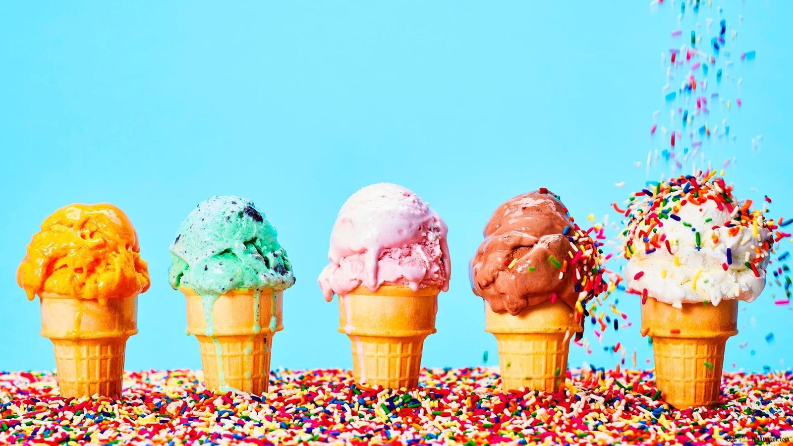 Colorful candies poured into ice cream with various fruits of all colors in cones 2K wallpaper download