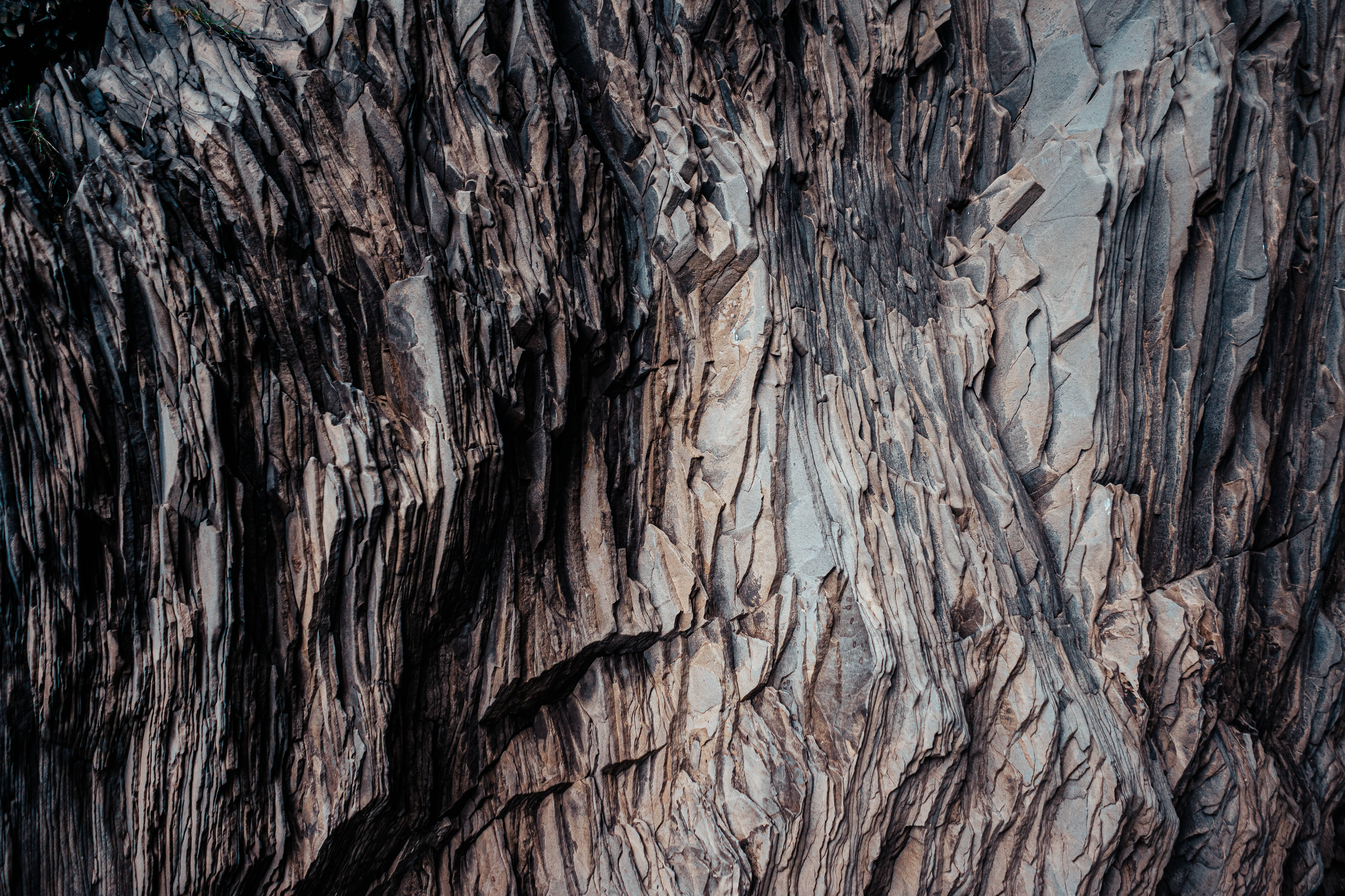 Download Hi Res Texture Of A Layered Dark Rock Wallpaper