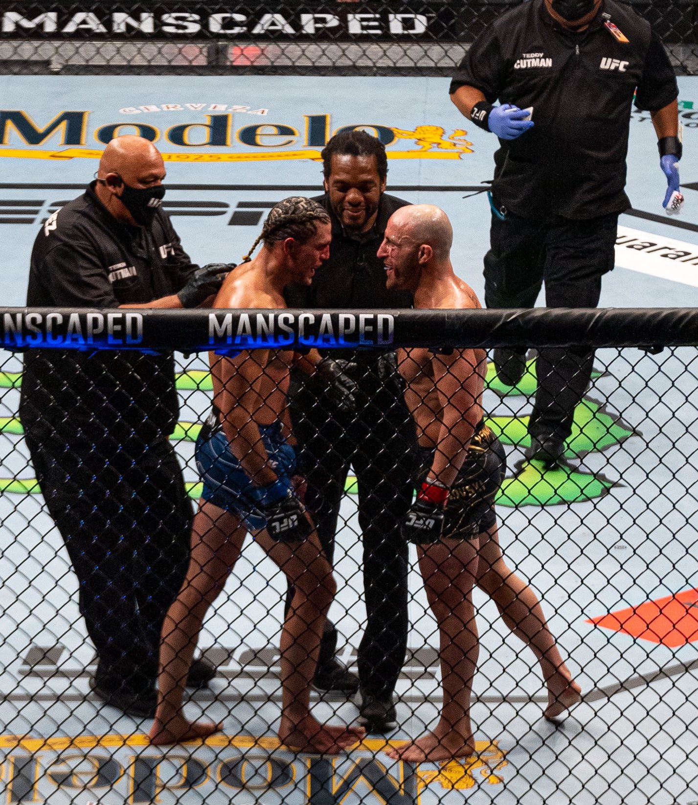 Fight Pics That Go Hard Volkanovski and Brian Ortega between rounds at UFC 266