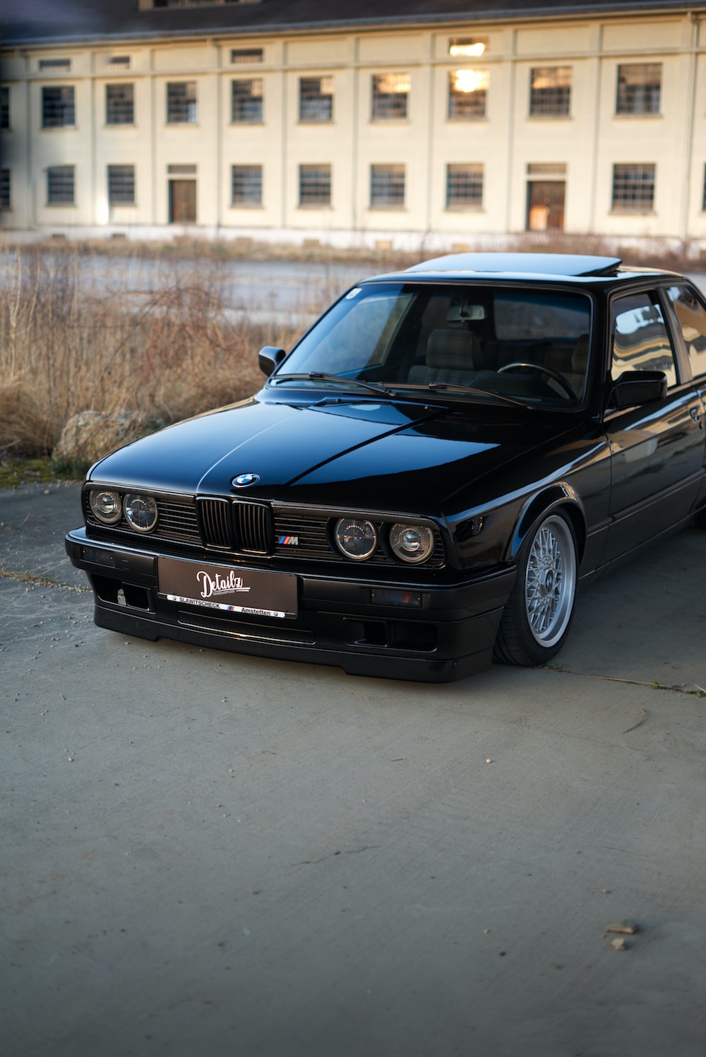 red bmw m 3 on road during daytime photo