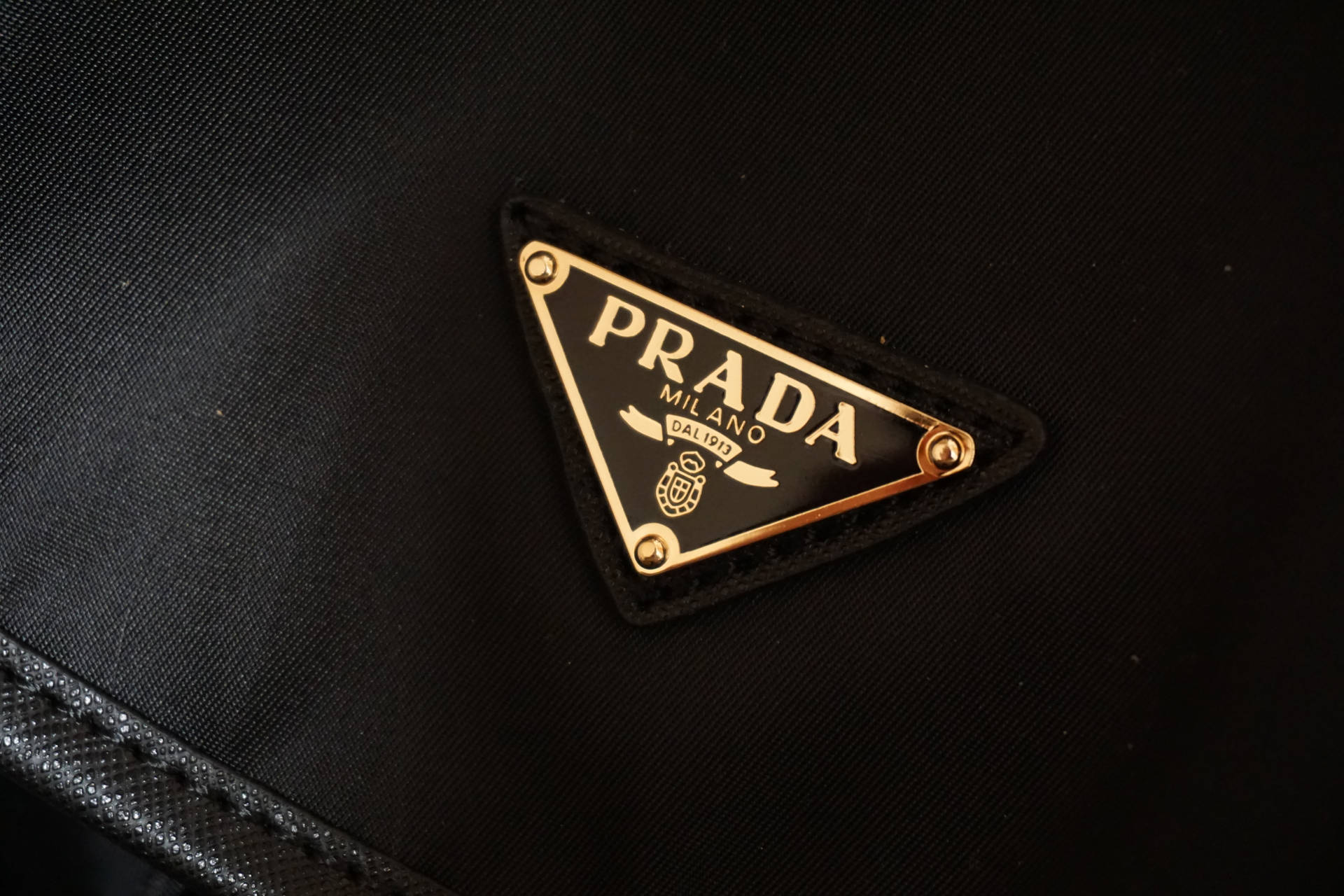 Download Prada Gold Badge Wallpaper