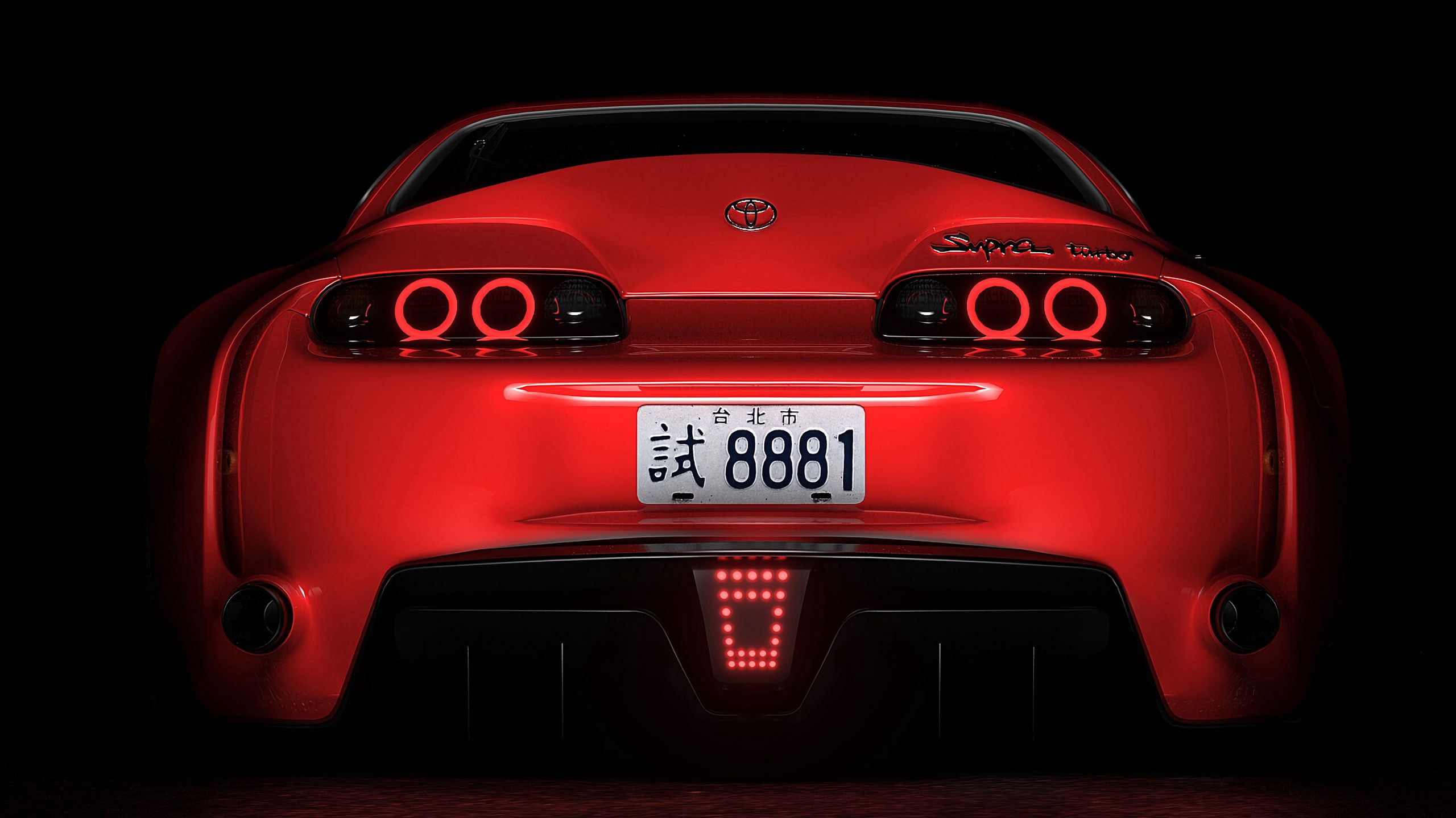 Download wallpaper 2560x1440 toyota supra, toyota, sportscar, red, rear view, dark, backlight widescreen 16:9 HD background