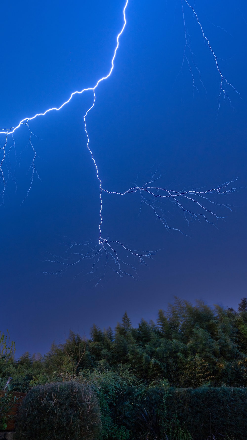 white lightning on blue sky photo