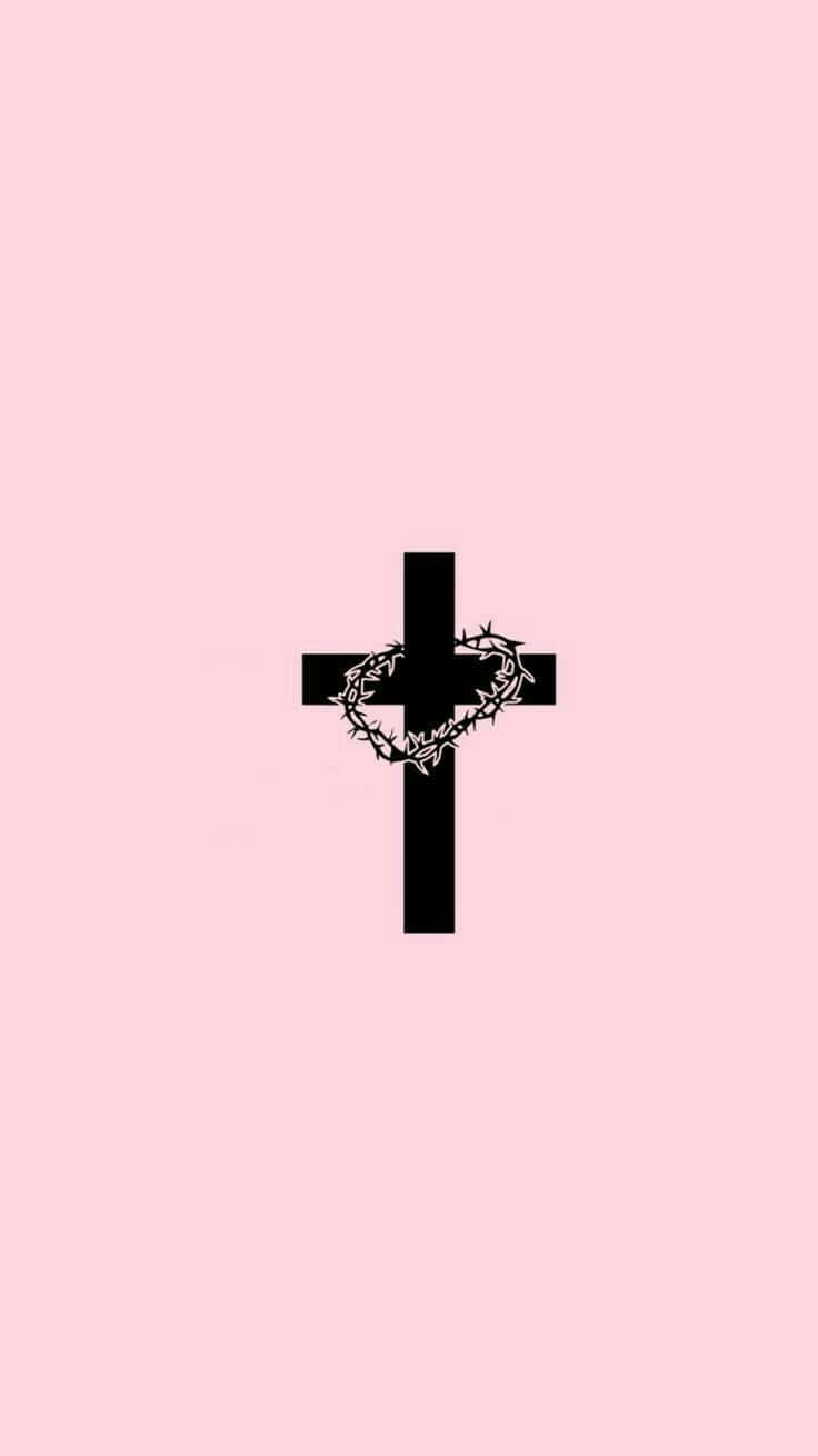 Download A Cross With Chains On A Pink Background Wallpaper