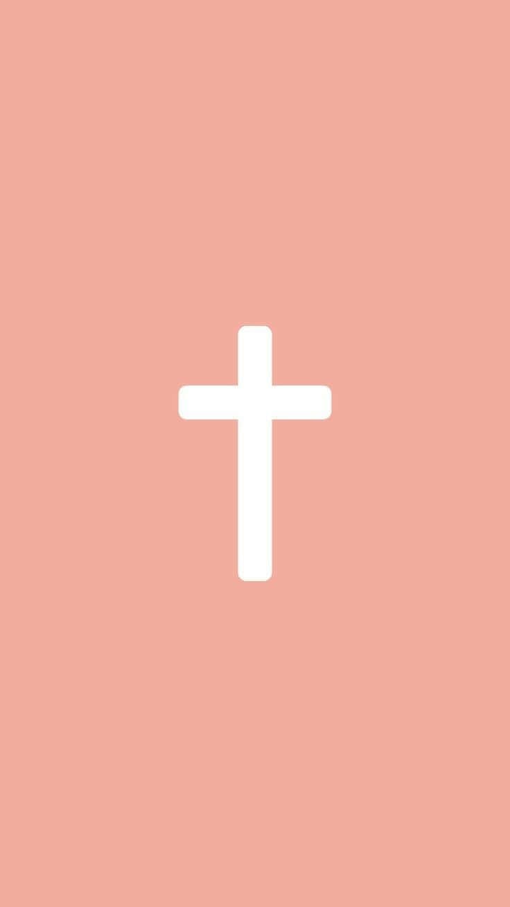 Download A White Cross On A Pink Background Wallpaper