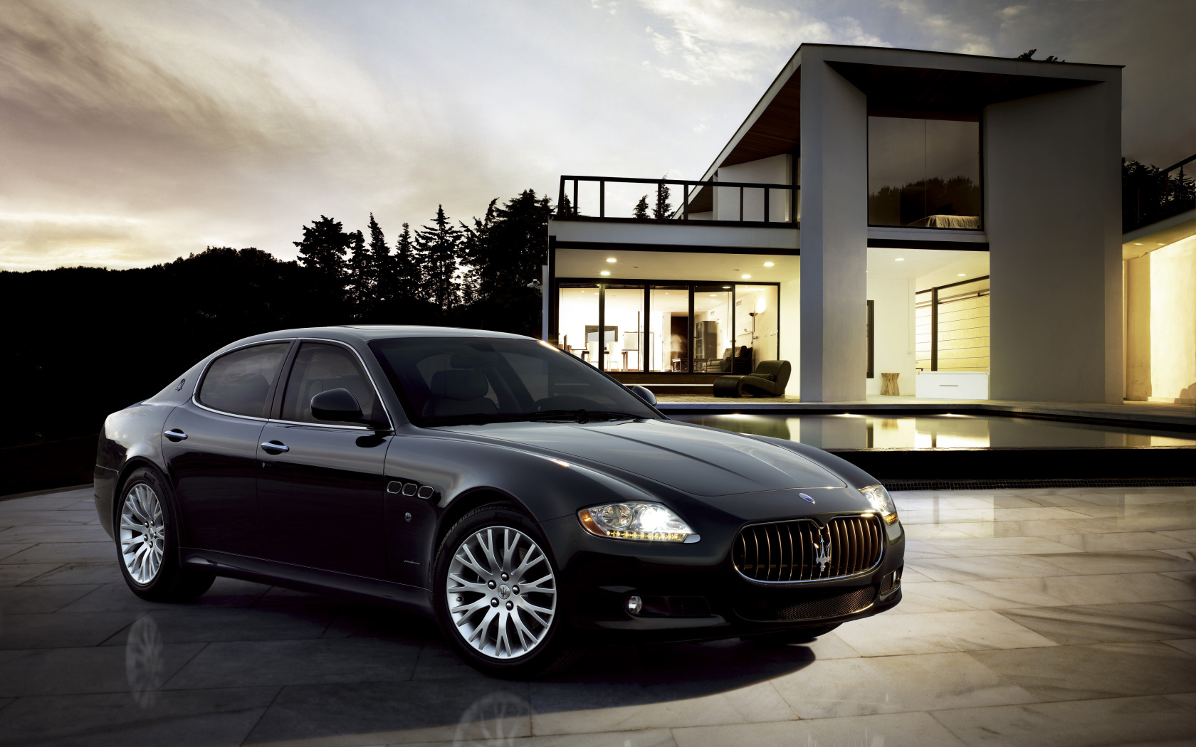 Black car Maserati Quattroporte at the big house Desktop wallpaper 1680x1050
