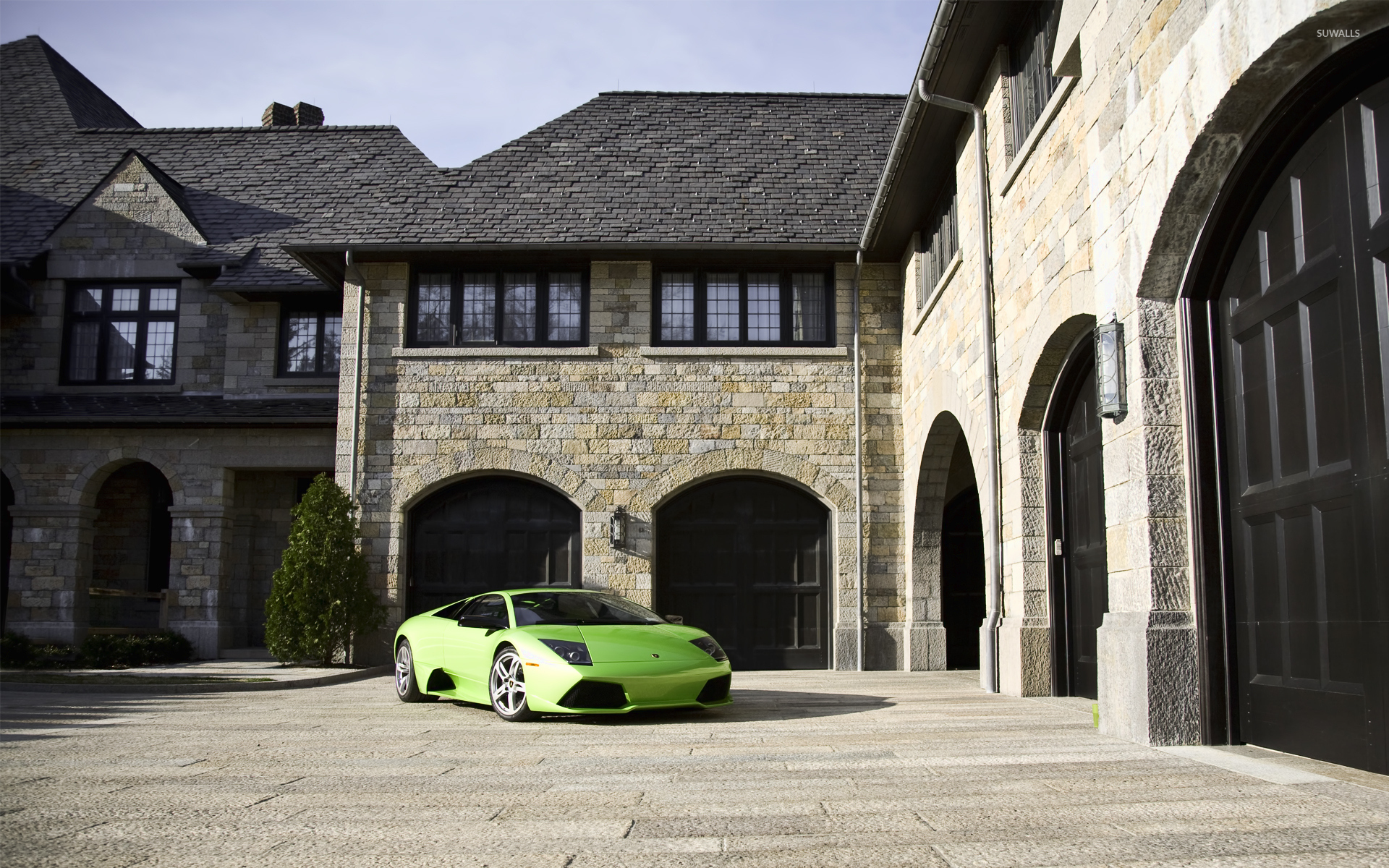Green Lamborghini Murcielago parked in front of a mansion wallpaper wallpaper