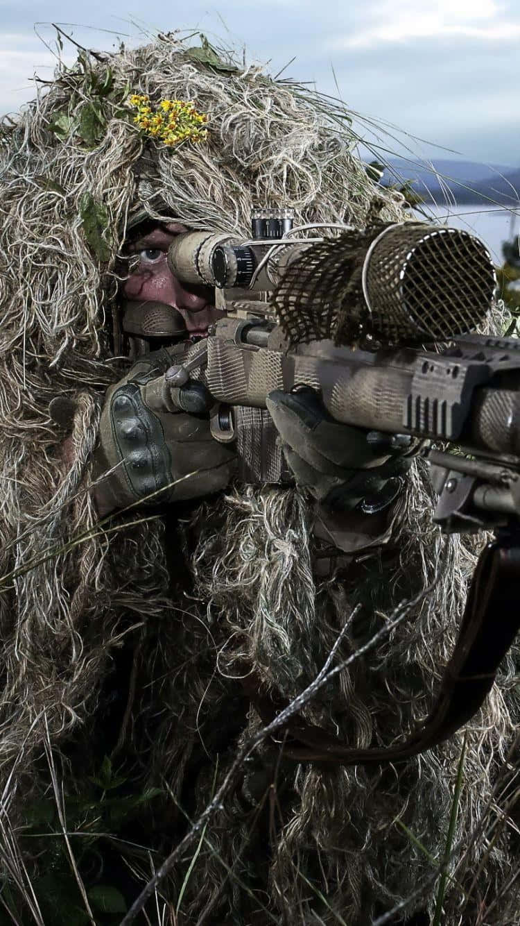 Download A Man In Camouflage Is Aiming His Rifle
