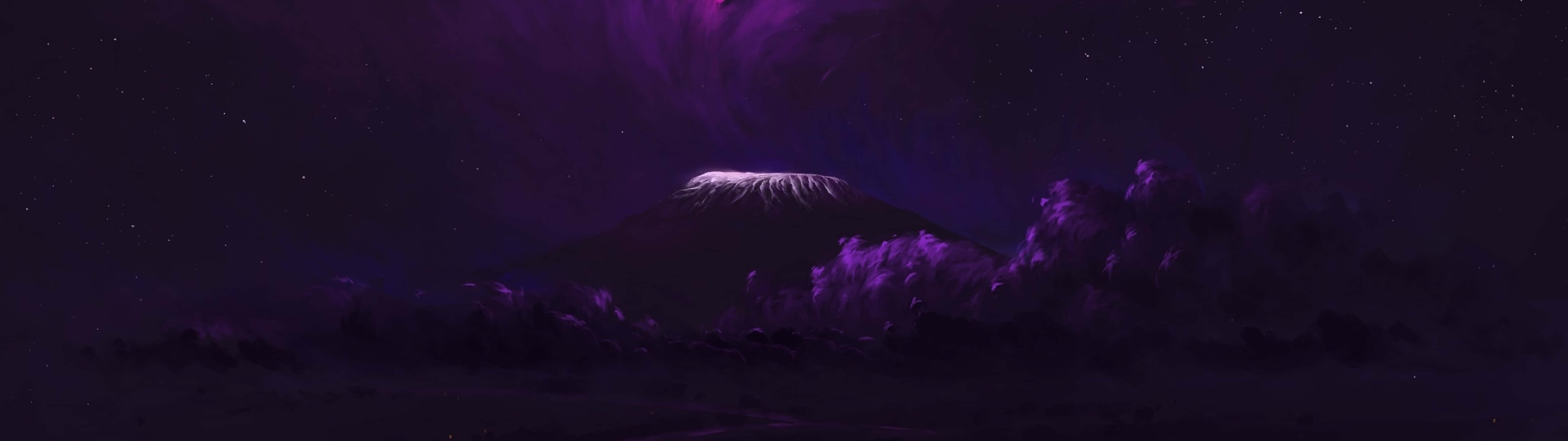 Download A Purple Mountain With A Purple Light Shining On It Wallpaper