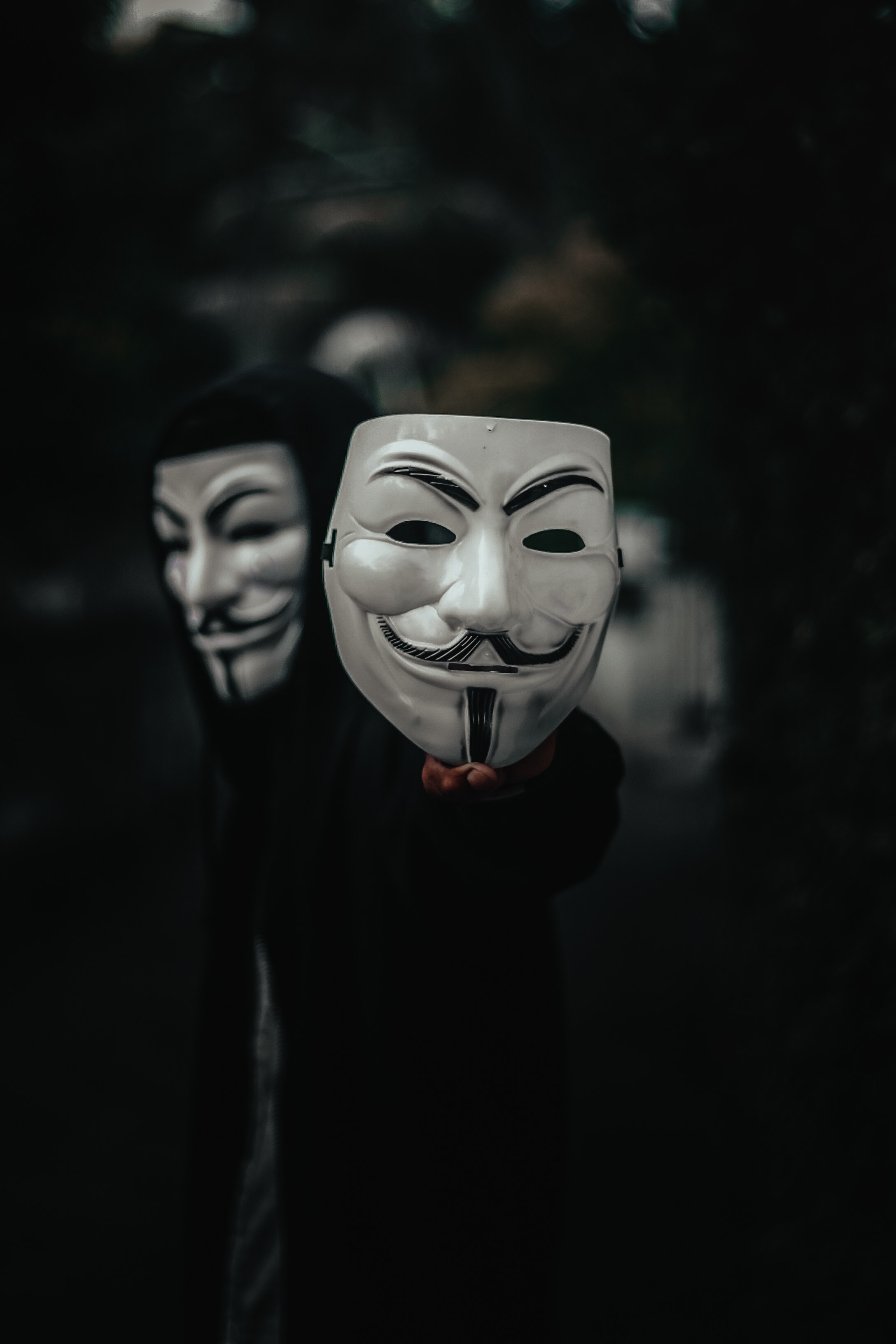 Download wallpaper 2176x3264 mask, anonymous, hand, hood HD background