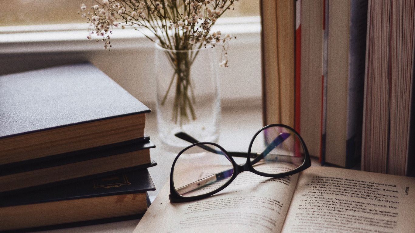 Download wallpaper 1366x768 books, glasses, vase, window, window sill, flowers tablet, laptop HD background