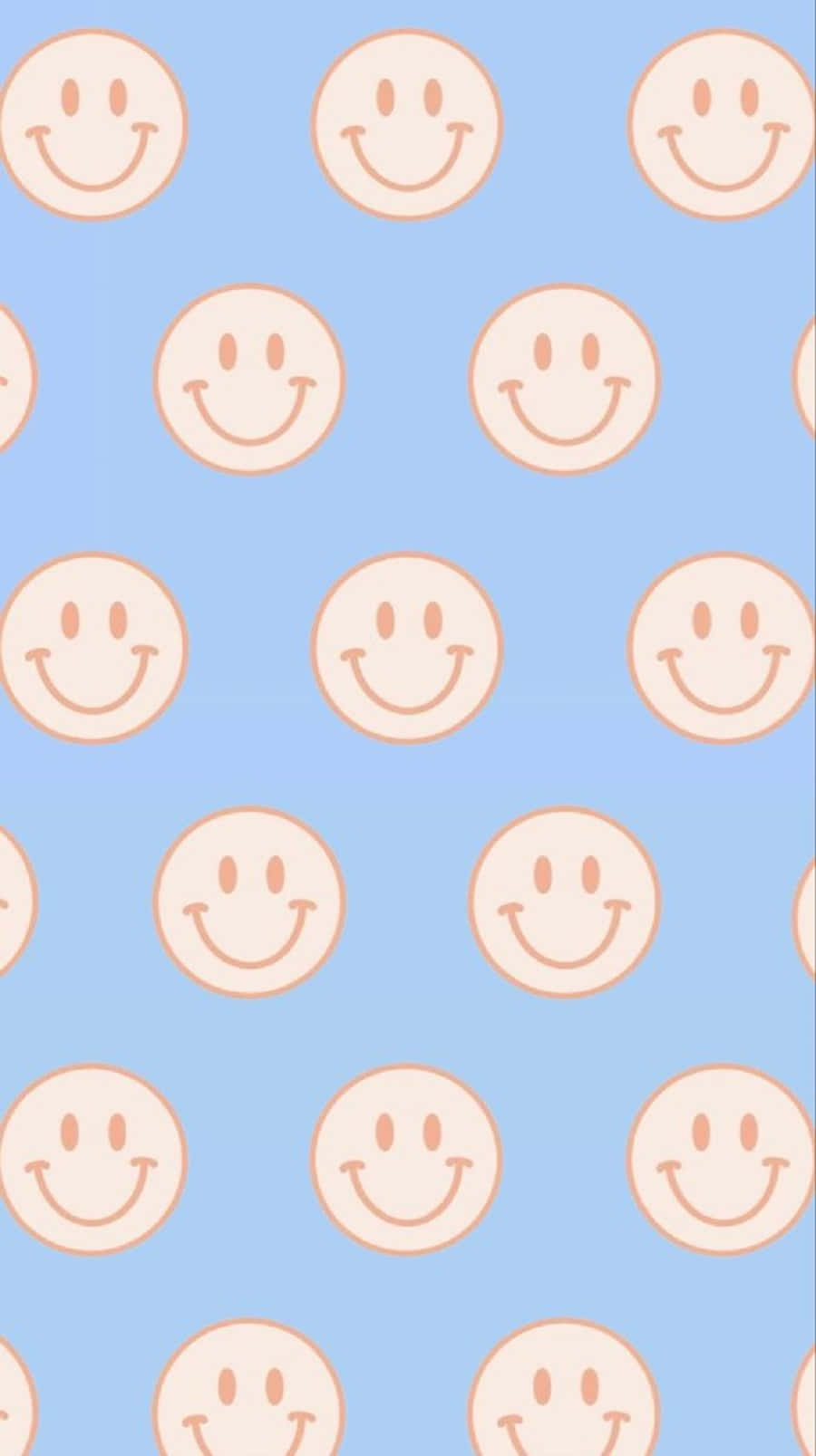 Download A Pattern Of Smiling Faces On A Blue Background