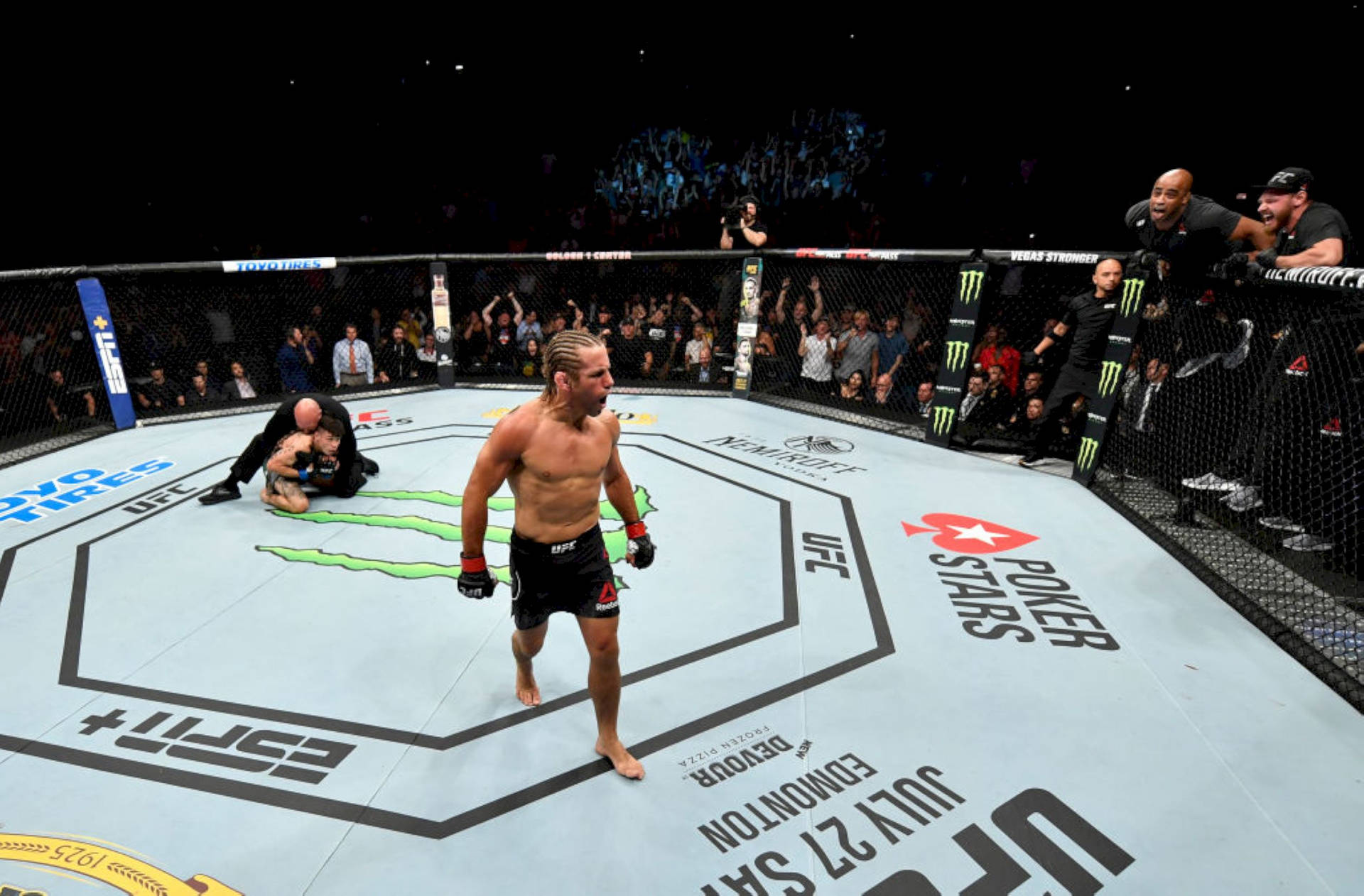 Download Urijah Faber In The Octagon Ring Wallpaper