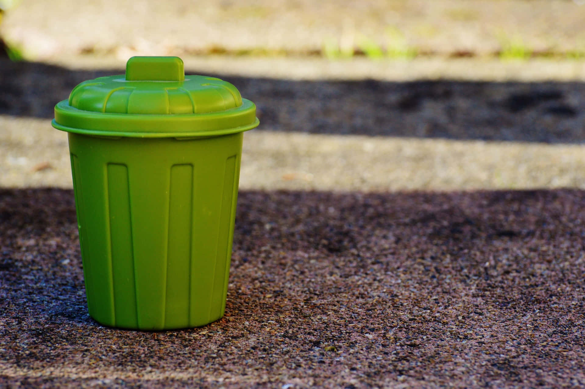 Download Miniature Green Trash Can With Lid Wallpaper