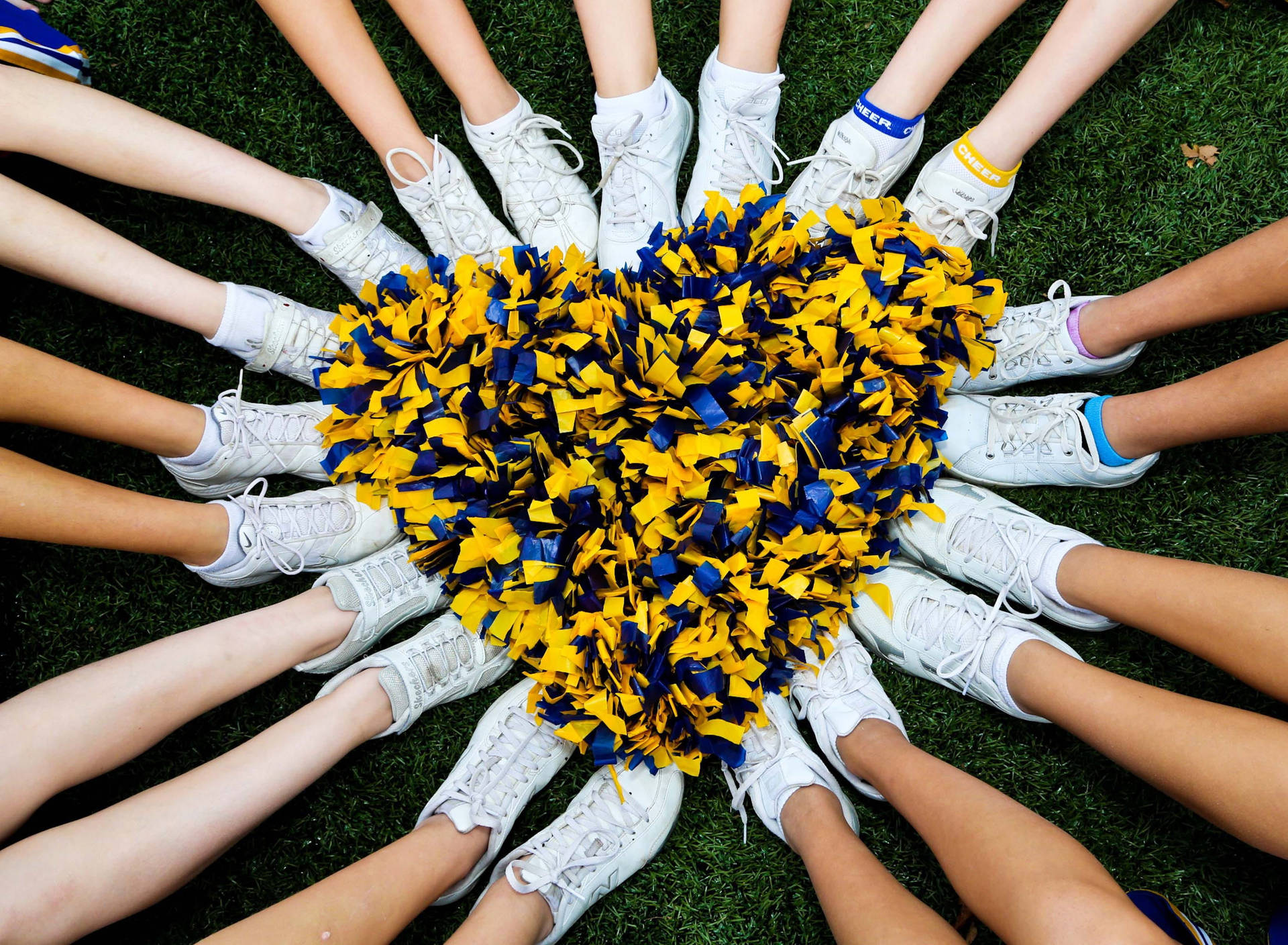Download Cheerleader Shoes Forming A Heart Wallpaper
