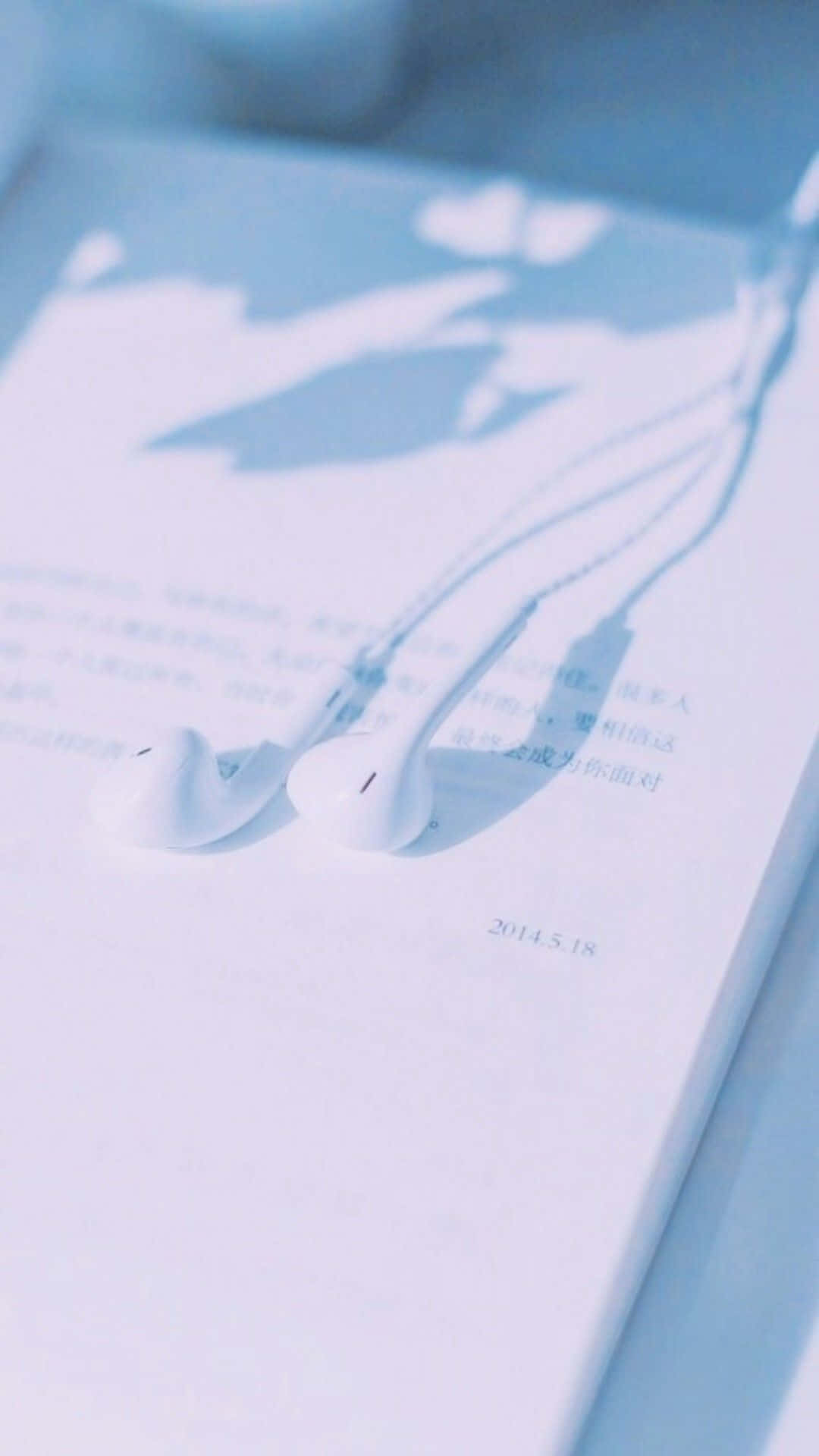 Download Open Book With Earphones Aesthetic Light Blue Wallpaper