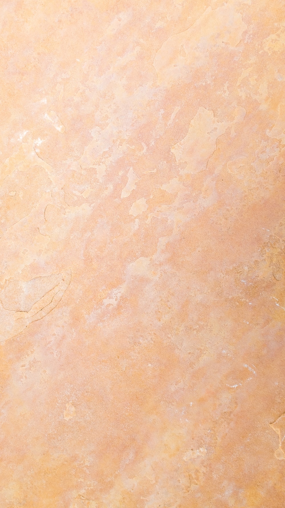 An orange and yellow marble textured background photo