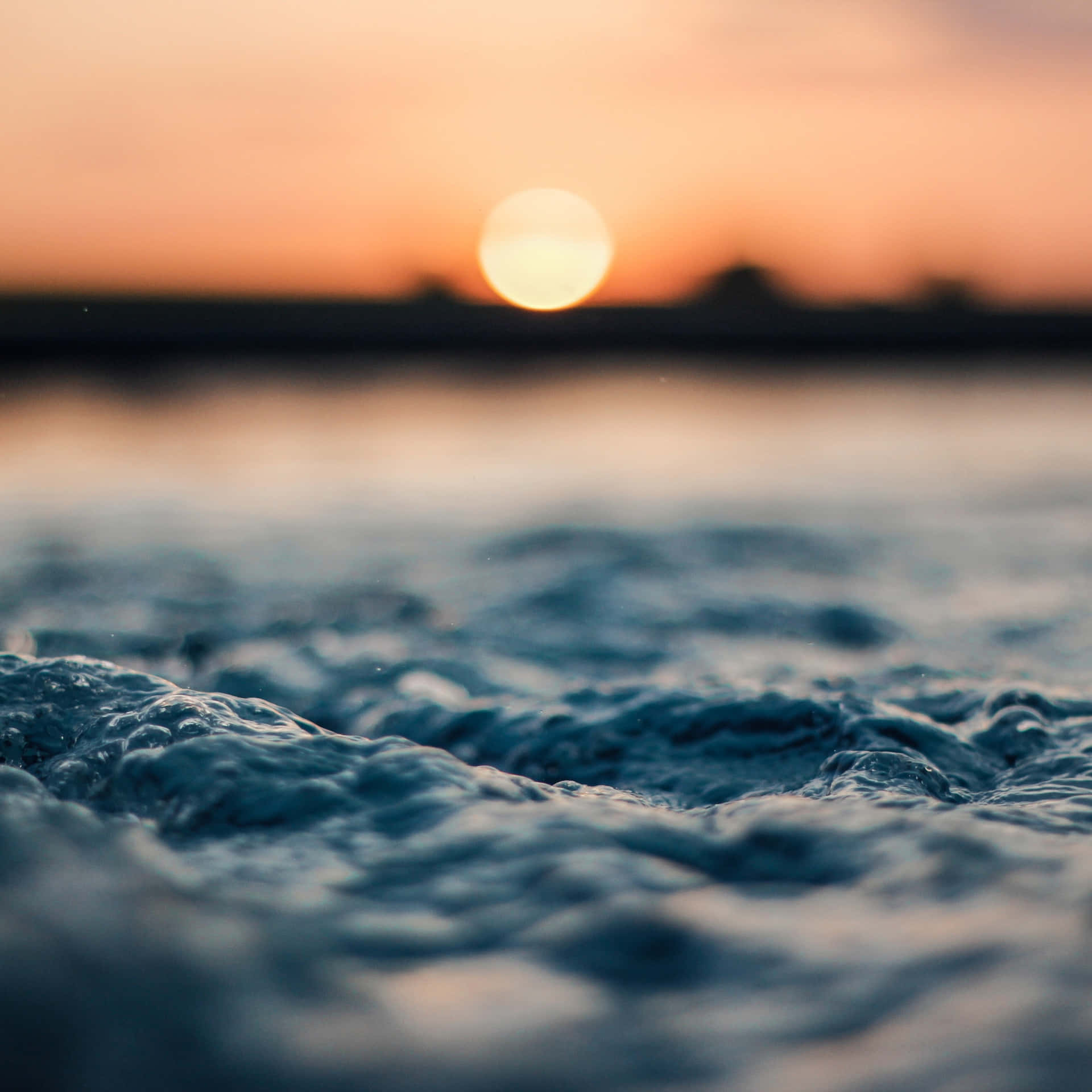 Download A Close Up Of Water At Sunset Wallpaper