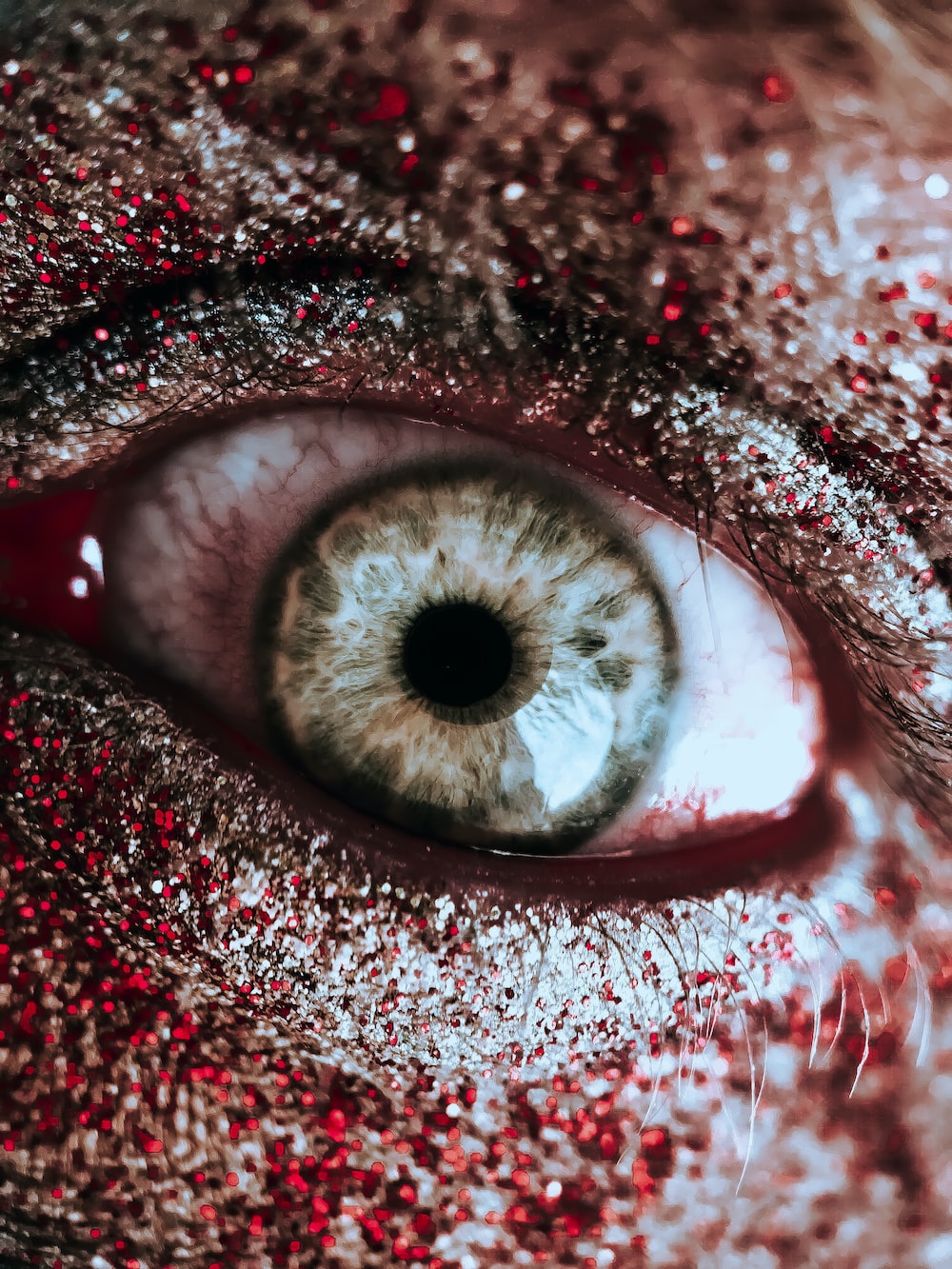 Person with red and silver eyeshadow photo