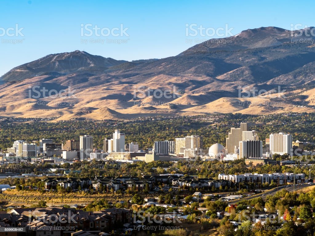 City Of Reno Nevada Cityscape In Early Autumn With Hotels Casinos Apartments And Mountains In The Background Image Now