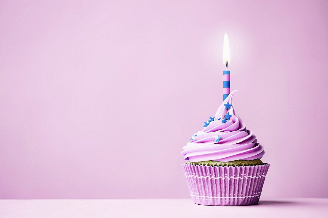 Purple birthday cupcake with copy space